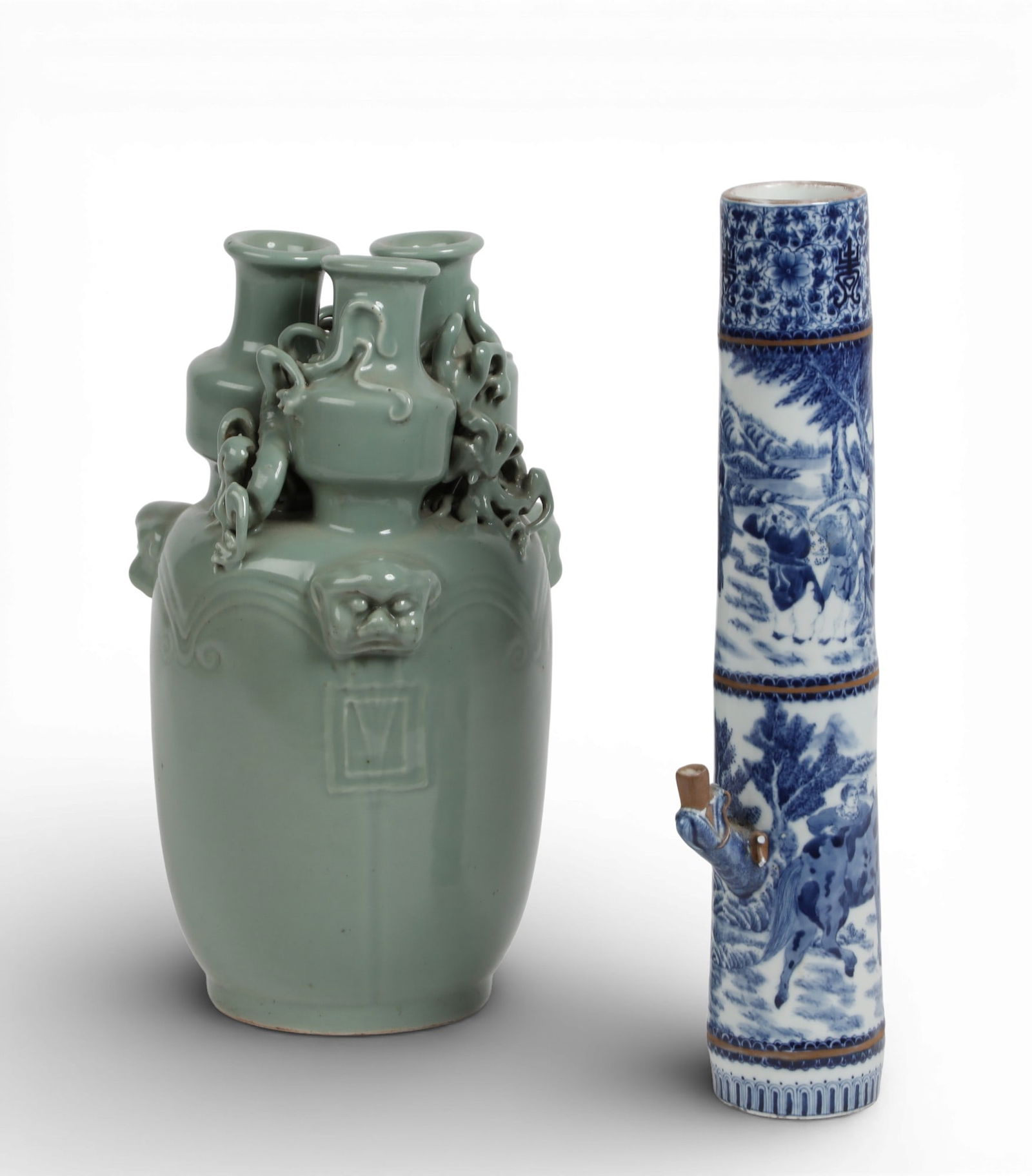 Two Chinese glazed porcelain vessels: Two Chinese glazed porcelain vesselsComprising a celadon triple necked vase and blue and white opium pipe.vase height 13in (32.5cm); diameter 7 1/2in (19cm) Provenance:Property from a Private Collect