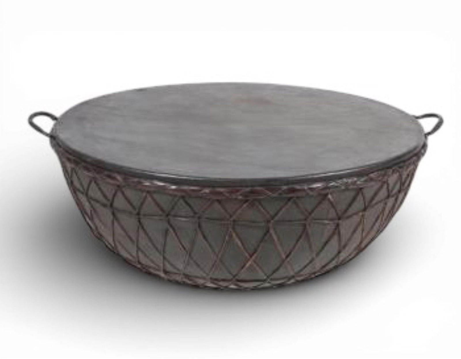 An imposing Afro-Indian riveted steel kettle drum: An imposing Afro-Indian riveted steel kettle drumtogether with single mallet.width over handles 45in (114.5cm); depth 40in (101.5cm); height 16in (40.5cm);