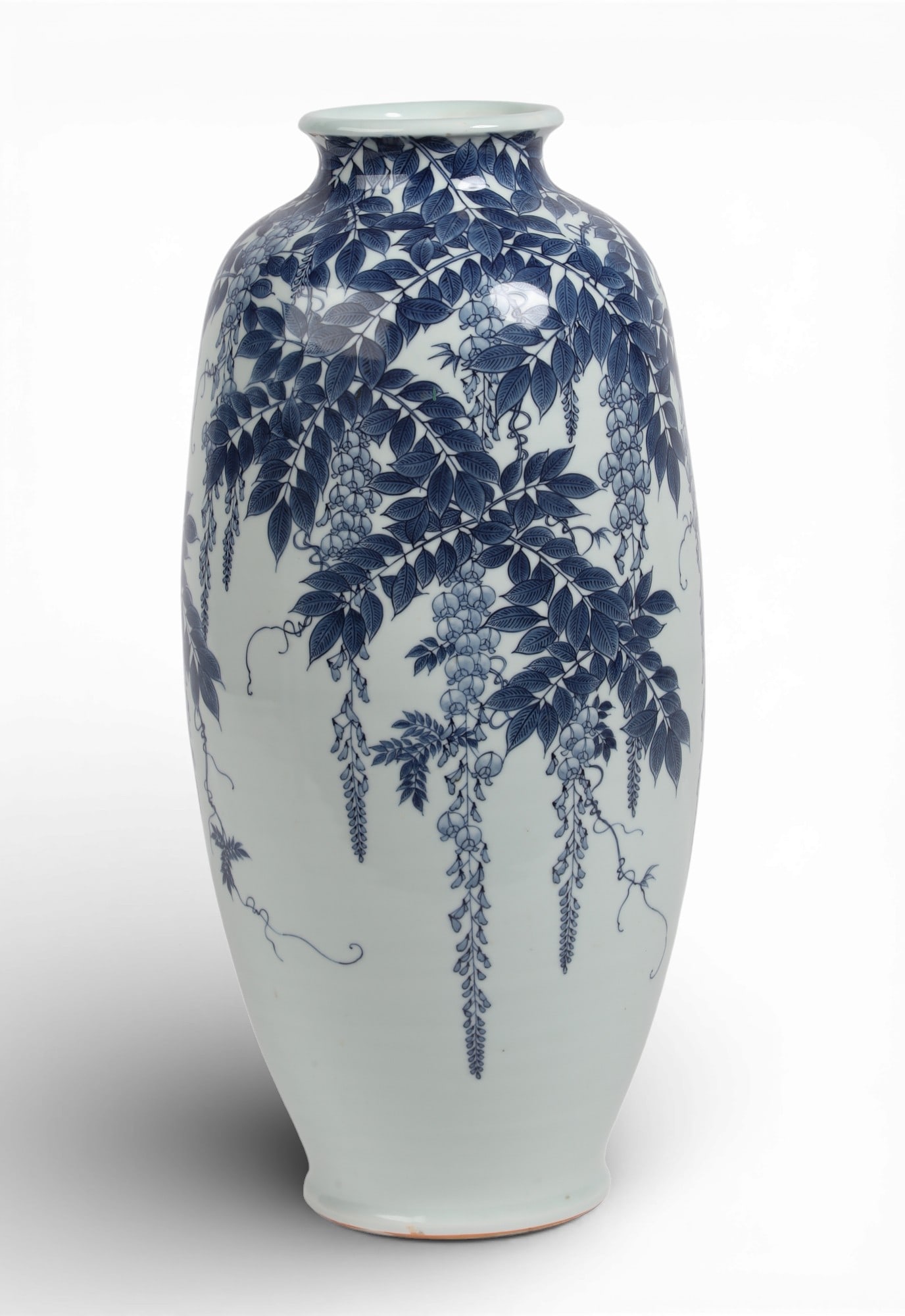 A large Japanese blue and white Nabeshima porcelain fuji/wisteria vase: A large Japanese blue and white Nabeshima porcelain fuji/wisteria vase With four character mark to underside. height 20 3/4in (53cm); diameter 8in (20cm) Provenance: Property from a Private Collection