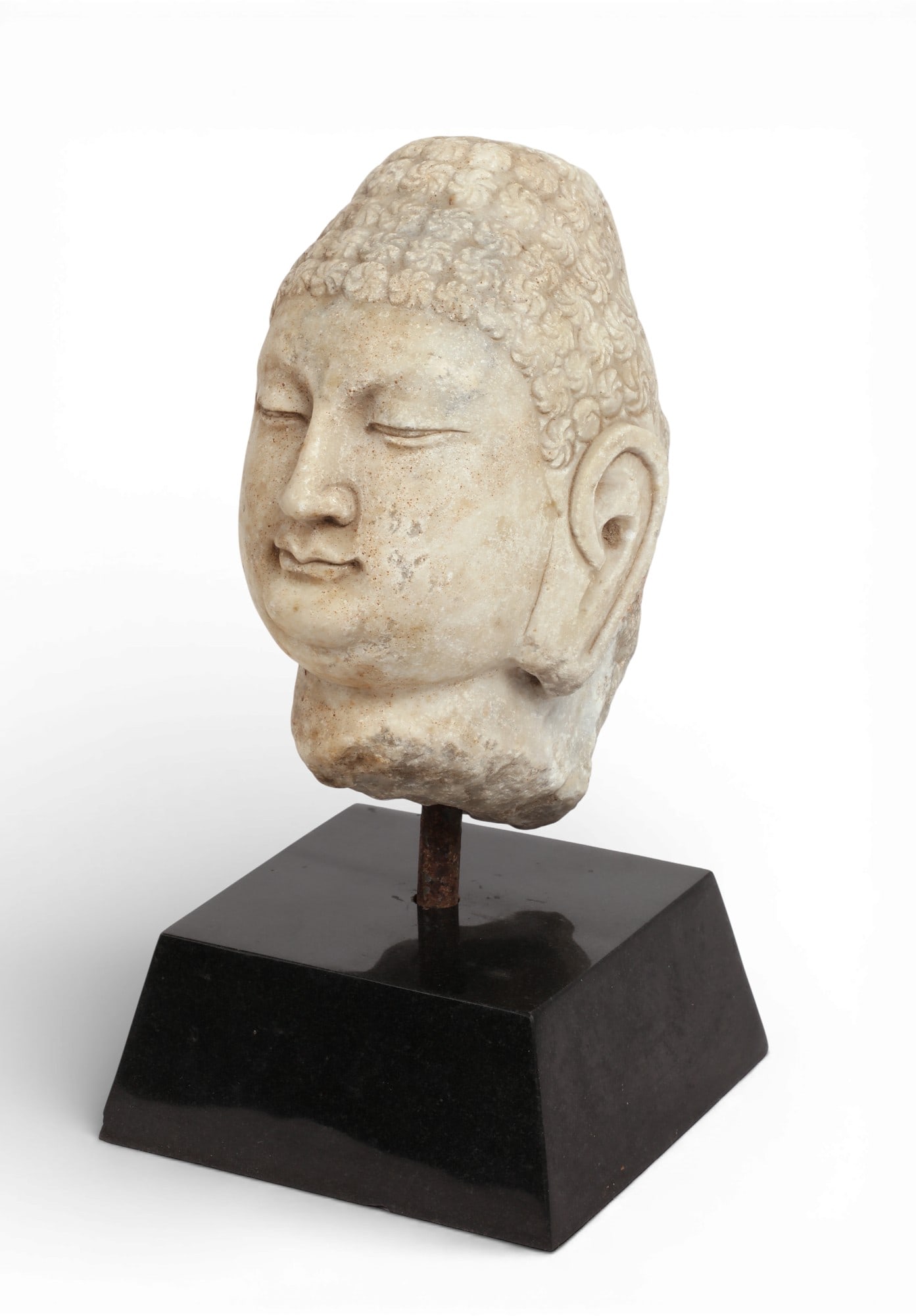 An Asian carved limestone head of buddha (1 of 4)
