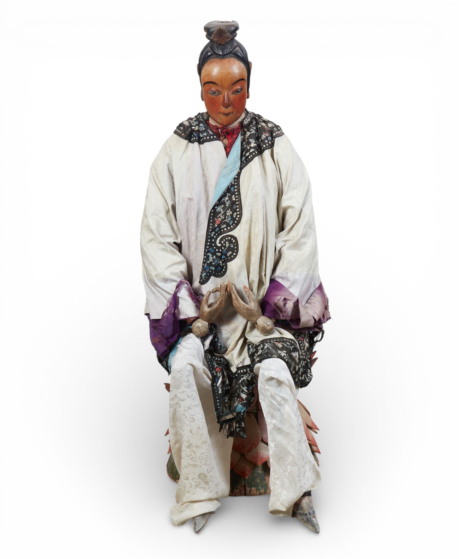 A Chinese polychrome decorated wood articulated model of an attendant (1 of 8)