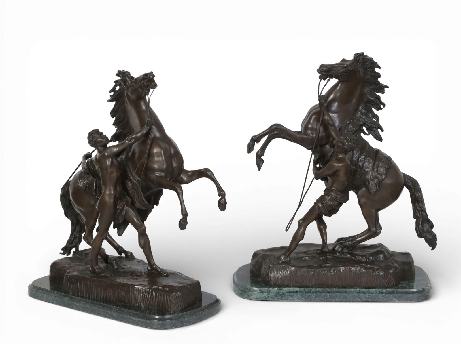 A pair of patinated bronze models of the Horse Trainers of Marley, after Coustou (1 of 9)