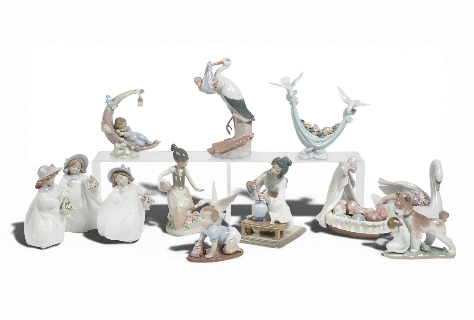 A set of twelve Lladro figures: A set of twelve Lladro figuresStork; height 10in (25.5cm); width 4 1/4in (10.5cm); depth 6 1/2in (16.5cm) Provenance:Property from a Private Collection, Beverly Hills, California.