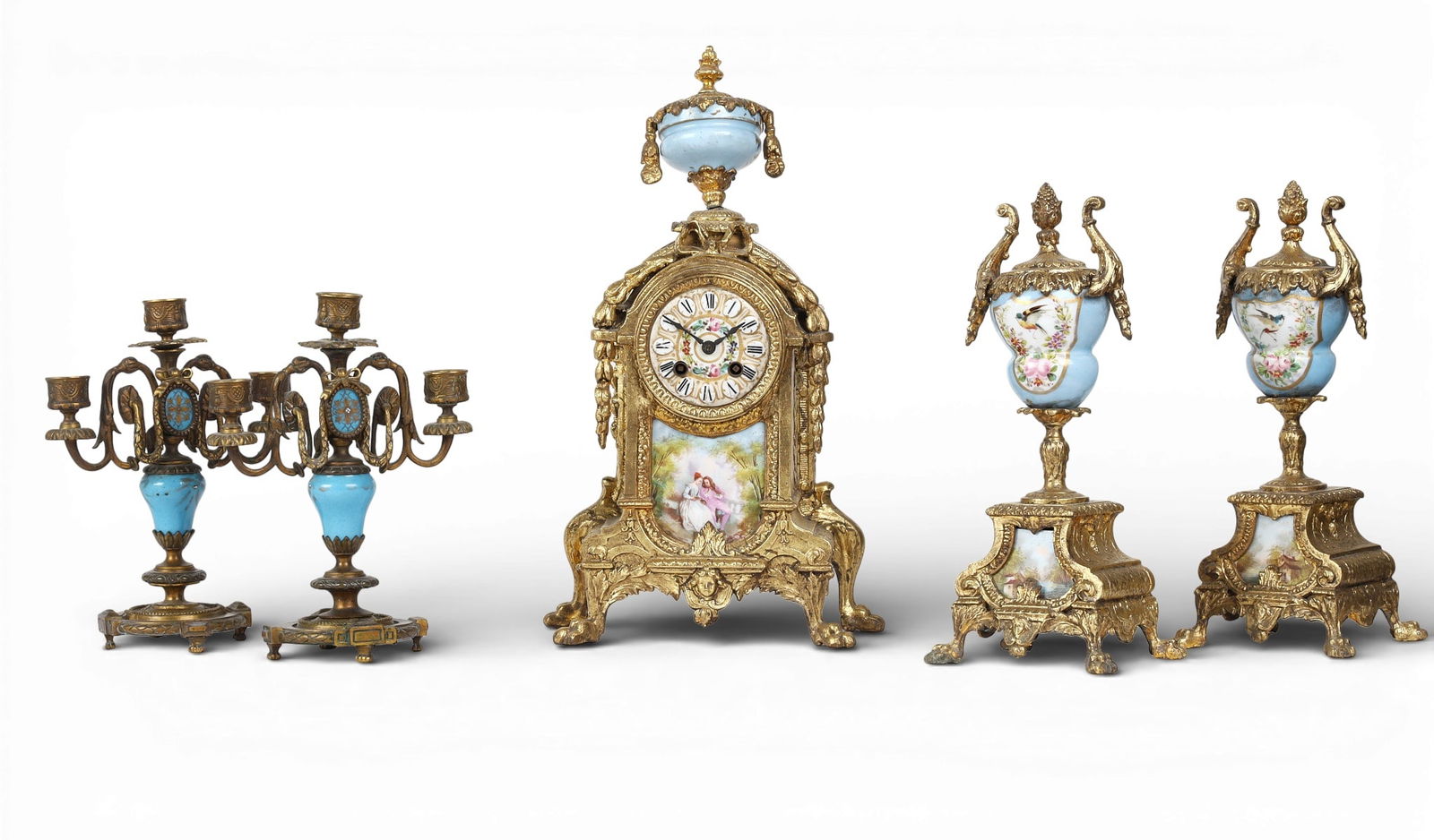 A three piece clock garniture together with a pair of three light candelabras (1 of 7)