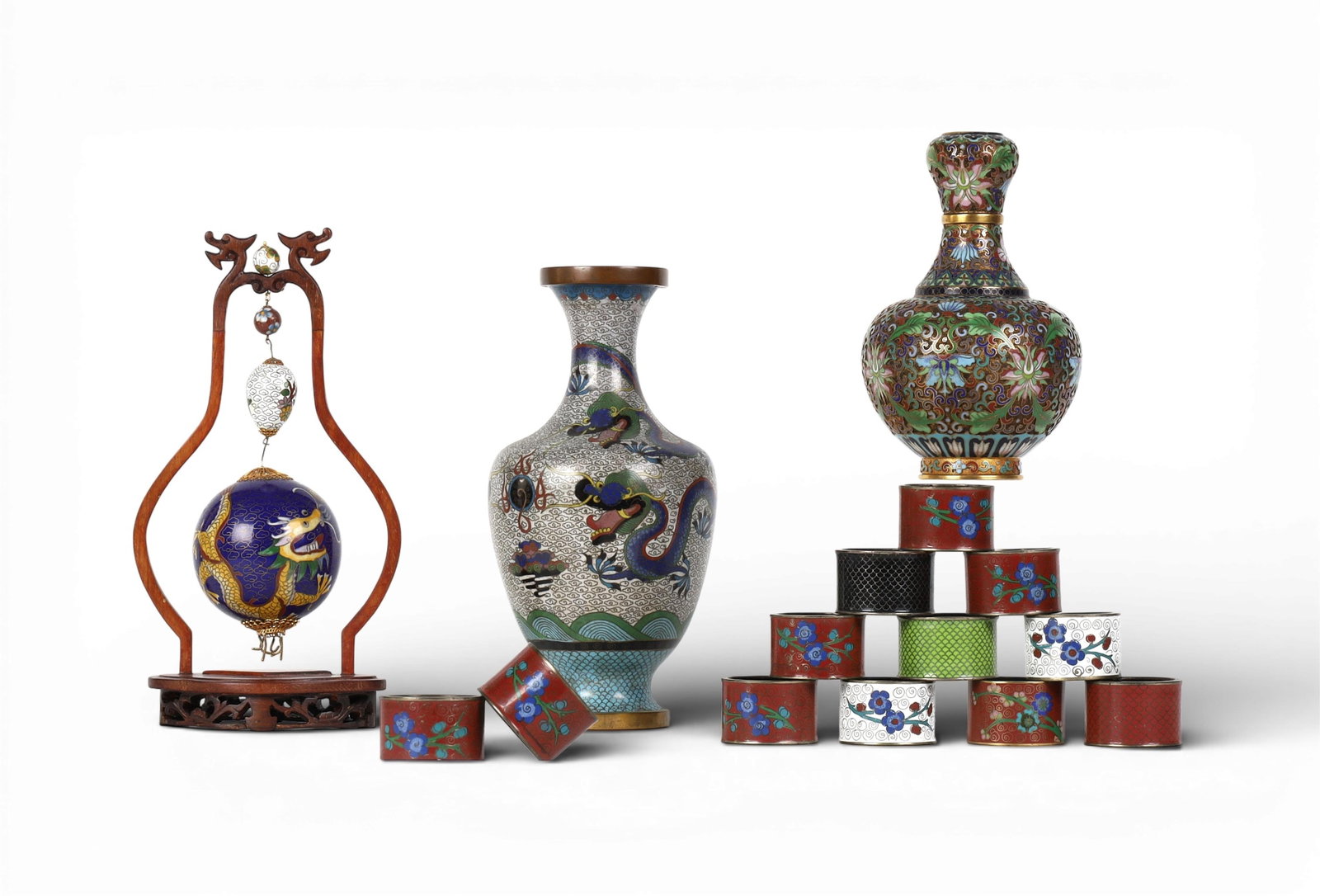 A group of thirteen Chinese cloisonne table articles: A group of thirteen Chinese cloisonne table articlesVase: height 9 1/2 x diameter 4 1/2 in. (24.1 x 11.4 cm.)