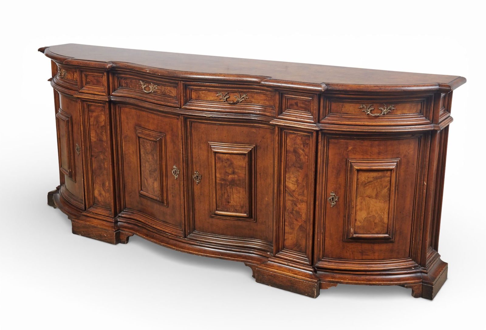 A serpentine front credenza.: A serpentine front credenza.height 38 1/2 x width 93 1/2 x depth 23 in. (97.8 x 237.5 x 58.4 cm.)