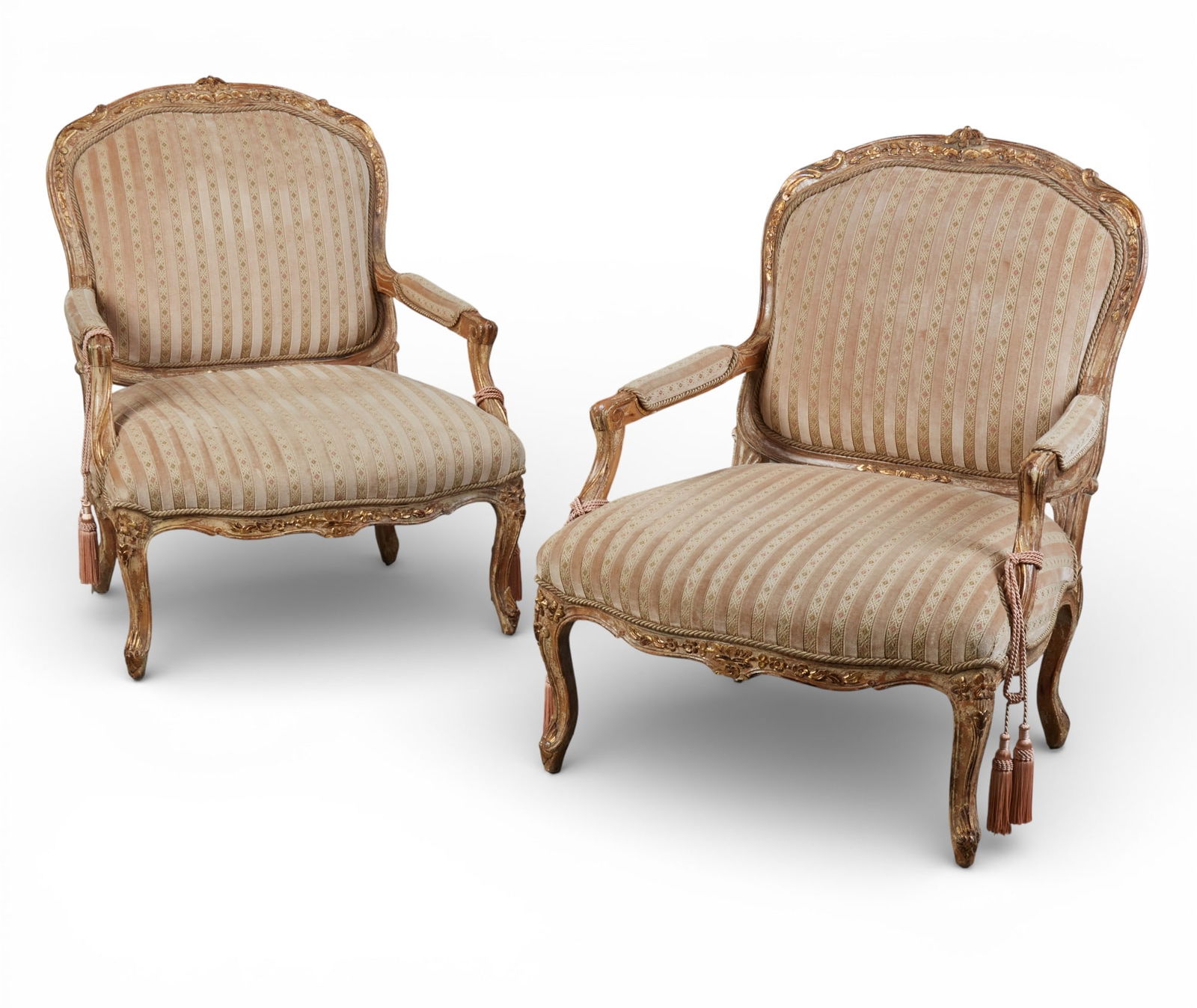 A pair of Louis XV style giltwood large armchairs: A pair of Louis XV style giltwood large armchairsheight 42 x width 33 x depth 35 in. (106.7 x 83.8 x 88.9 cm.)