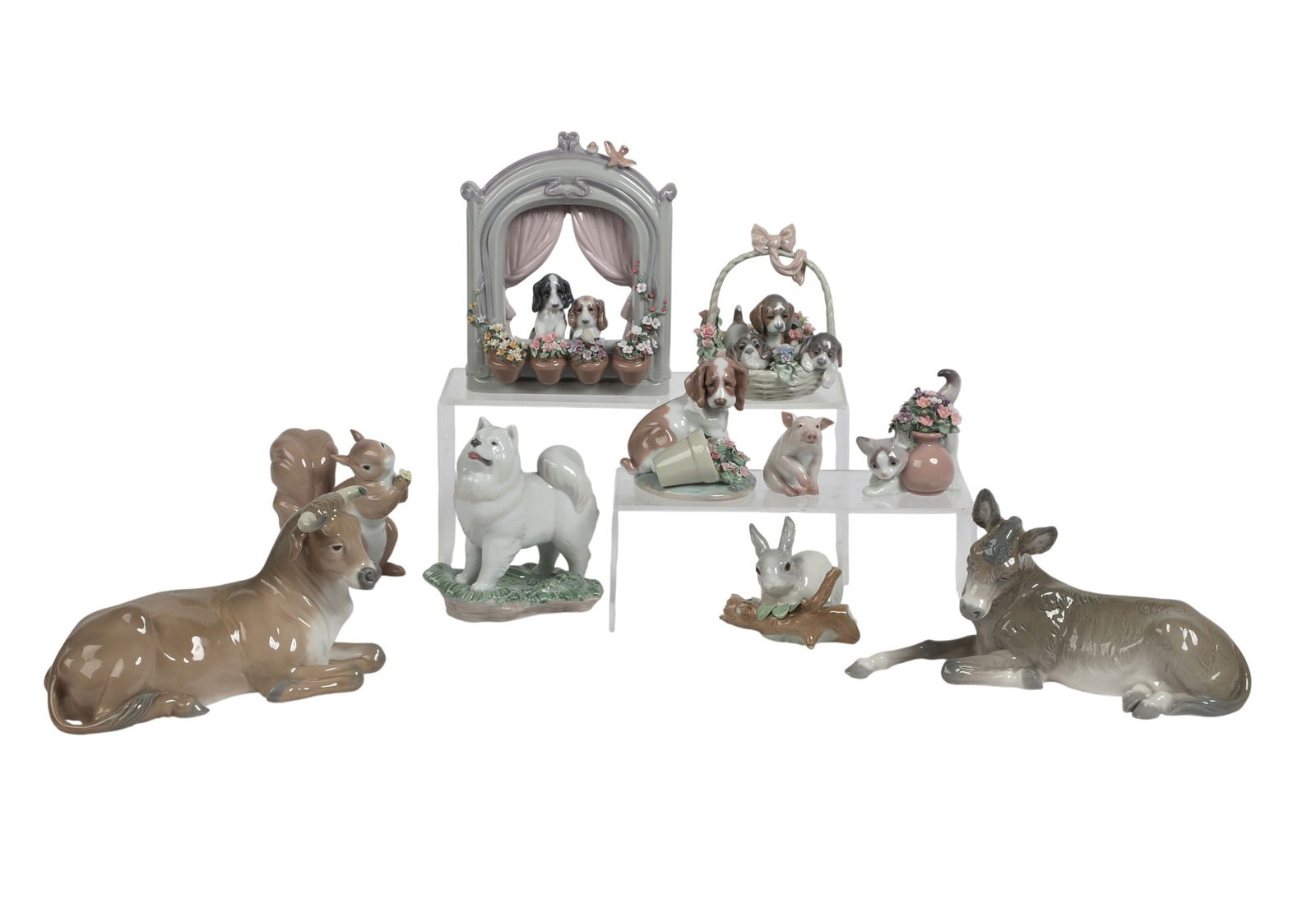 A group of ten Lladro animalier figures: A group of ten Lladro animalier figures Cow; height 6in (15cm); width 10in (25.5cm); depth 4 1/2in (11.5cm) Provenance: Property from a Private Collection, Beverly Hills, California.