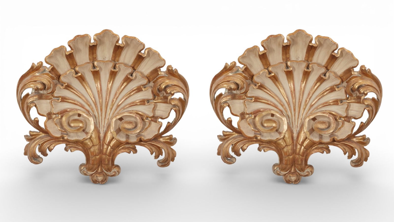 A pair of Louis XV carved gilt wood plaques: A pair of Louis XV carved gilt wood plaques25 1/2 x 27 in. (64.8 x 68.6 cm.)