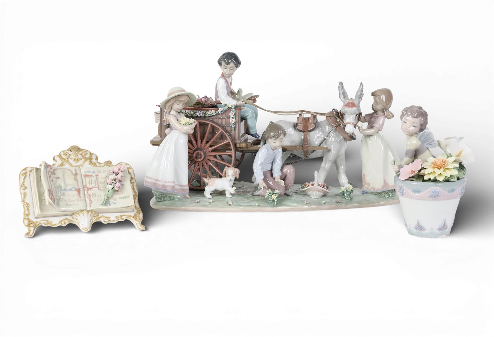 A group of three Lladro decorations: A group of three Lladro decorations largest; height 10 1/2in (26.5cm); width 19in (48cm); depth 9 1/2in (24cm) Provenance: Property from a Private Collection, Beverly Hills, California.