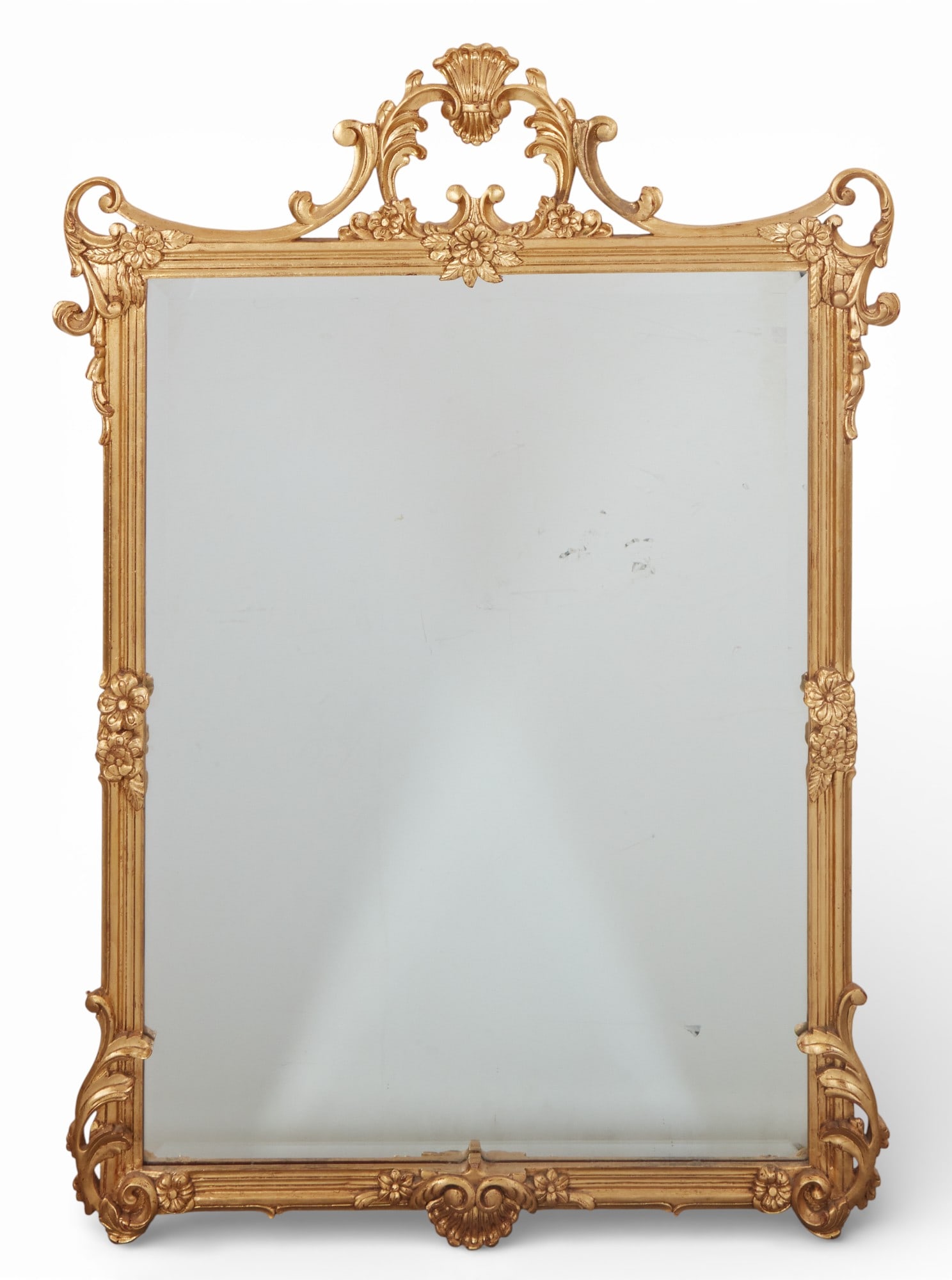 A giltwood wall mirror: A giltwood wall mirror54 x 37 in. (137.2 x 94 cm.)