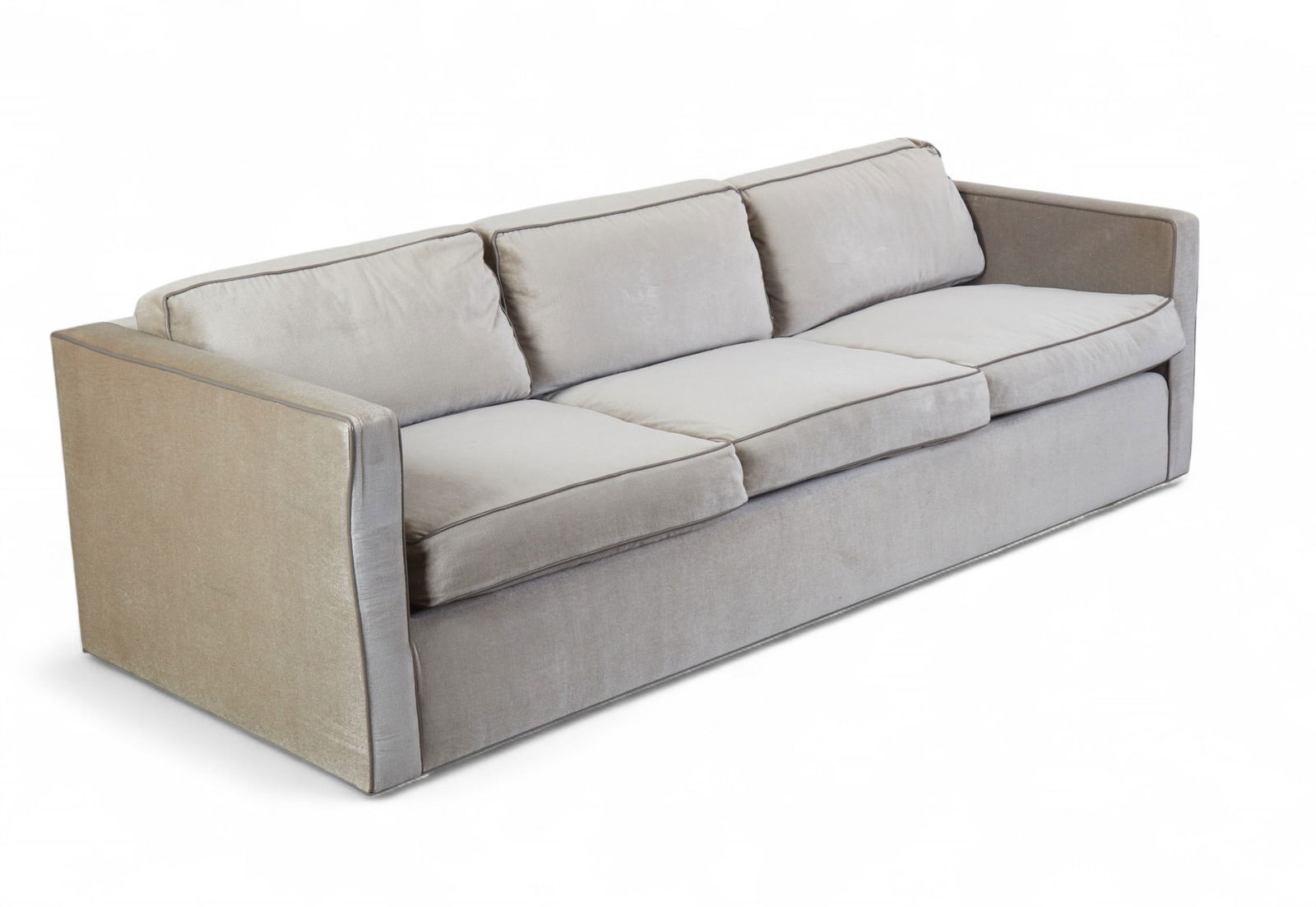 A contemporary grey custom made upholstered sofa with leather piping: A contemporary grey custom made upholstered sofa with leather pipingheight 27 x width 90 x depth 35 in. (68.6 x 228.6 x 88.9 cm.)