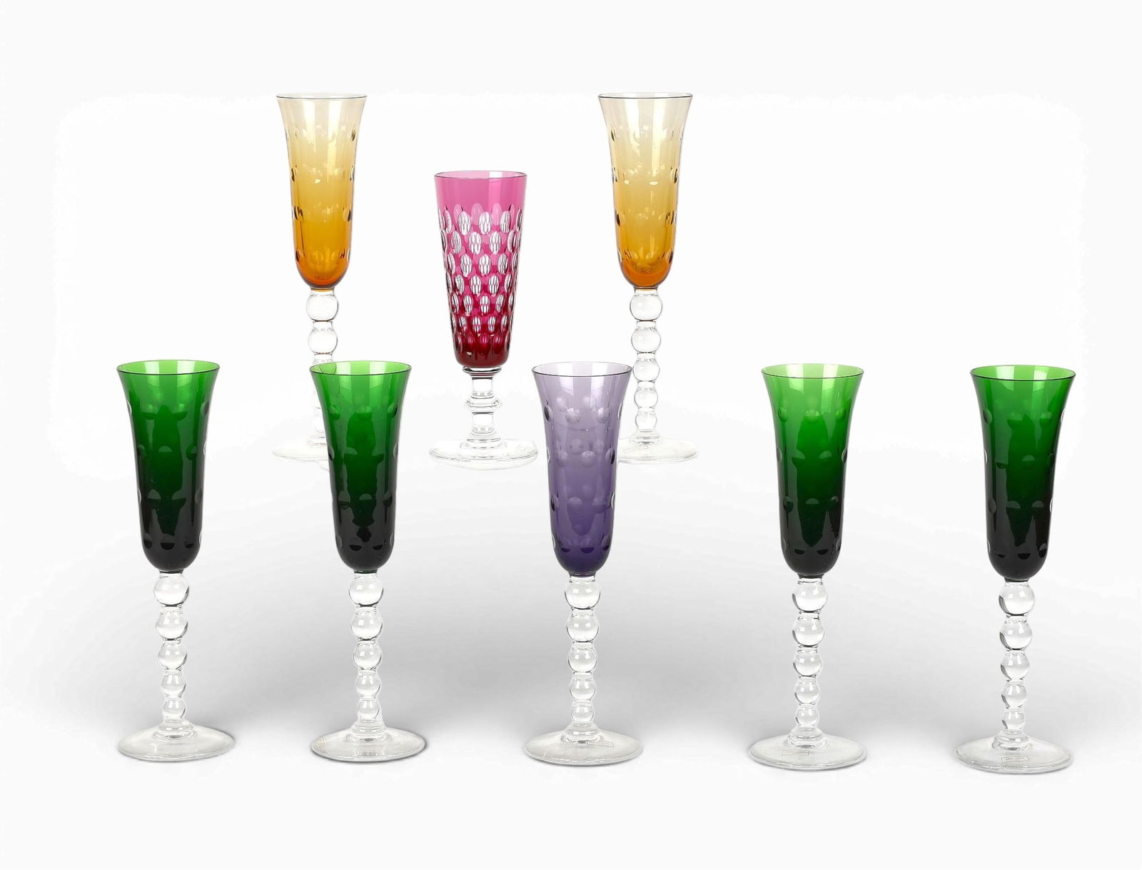 A set of seven Saint Louis champagne flutes in the Bubbles pattern, together with another Saint: A set of seven Saint Louis champagne flutes in the Bubbles pattern, together with another Saint Louis glass (8)height 9 1/4in (23cm) Provenance:Property from a Private Collection, Beverly Hills, Calif