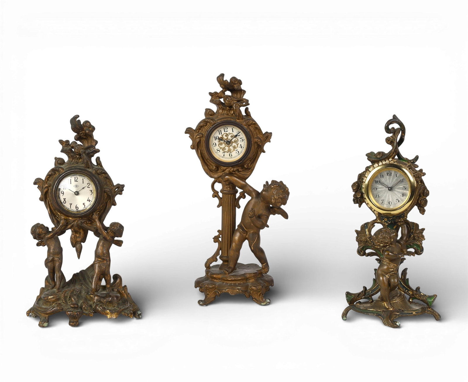 A group of three gilt metal table clocks (1 of 8)