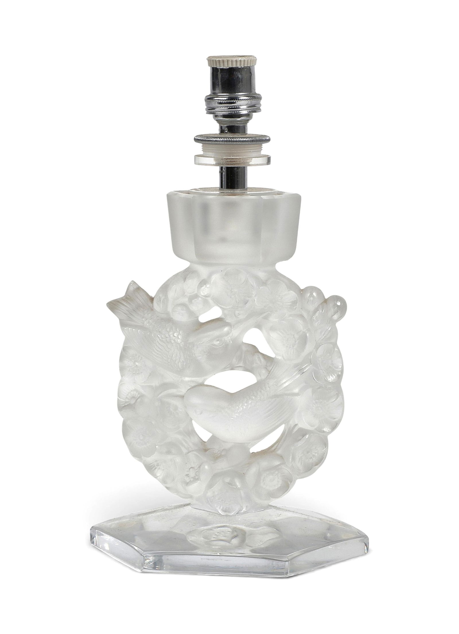 A Lalique table lamp: A Lalique table lampheight 9 x width 5 x depth 5 in. (22.9 x 12.7 x 12.7 cm.)