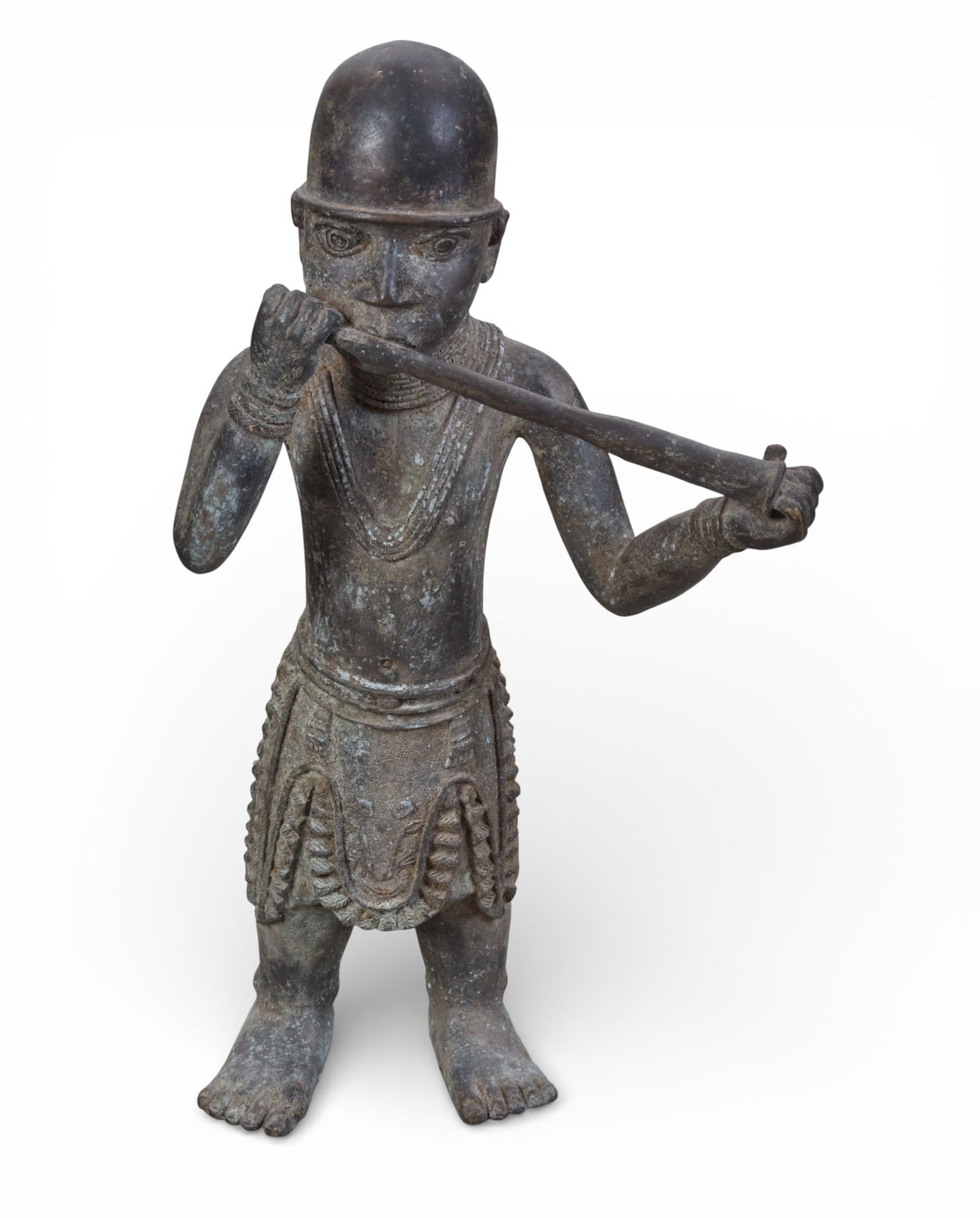 A West African metal Benin figure depicting a horn blower: A West African metal Benin figure depicting a horn blower height 22 x width 12 in. (55.9 x 30.5 cm.)