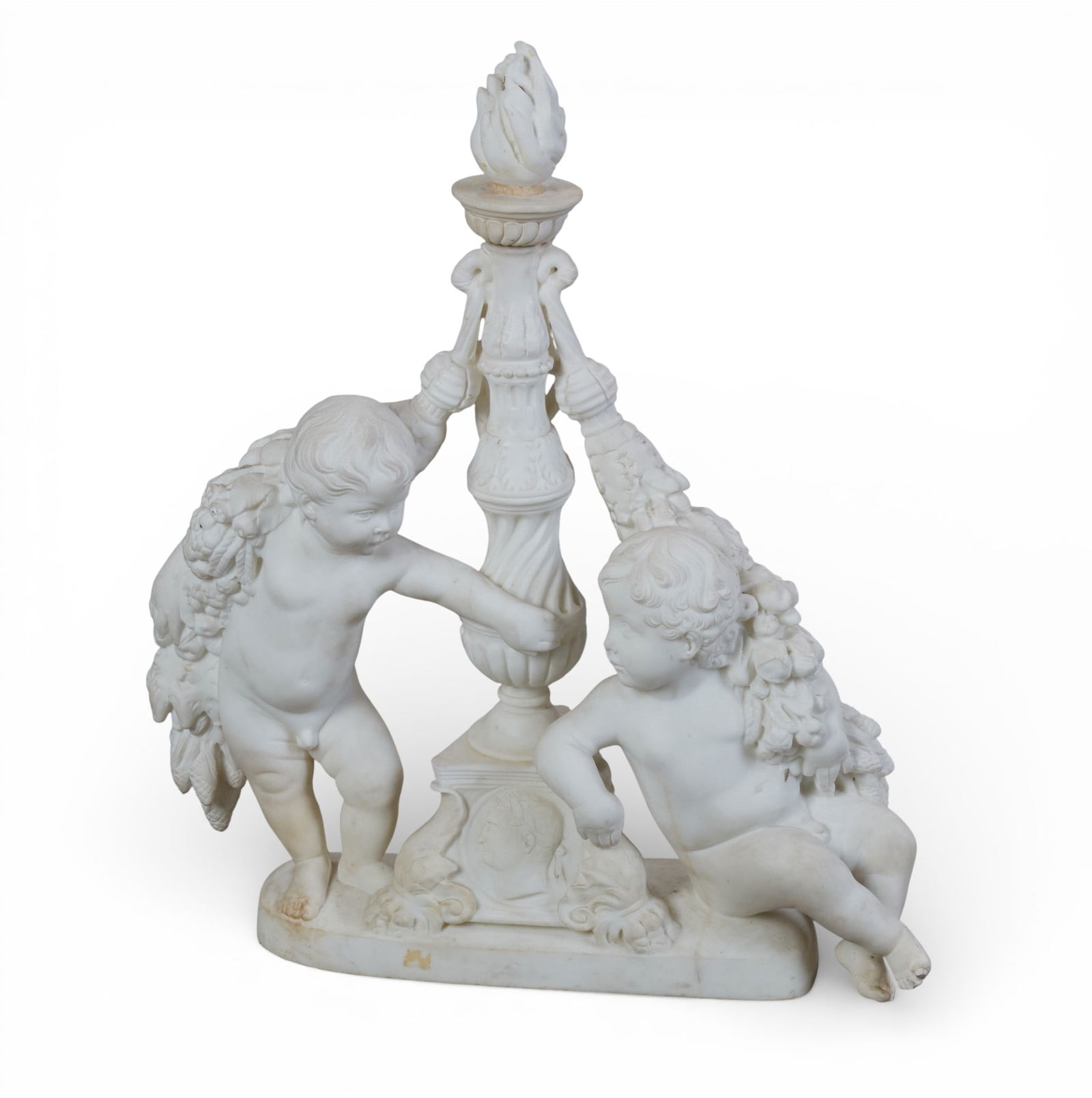 A marble sculpture of two cherubs: A marble sculpture of two cherubs height 32 x width 26 x depth 8 in. (81.3 x 66 x 20.3 cm.)