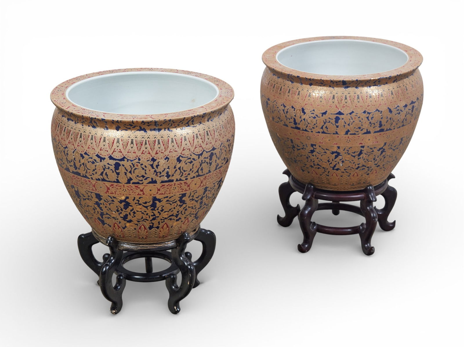 A pair of Chinese planters on wooden stands: A pair of Chinese planters on wooden stands Planter: height 15 x diameter 20 in. (38.1 x 50.8 cm.)