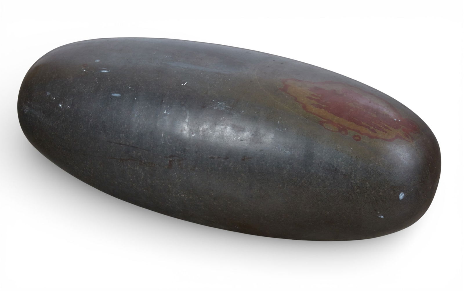 A large Indian lingam stone: A large Indian lingam stoneheight 11 1/2 x width 32 in. (29.2 x 81.3 cm.)