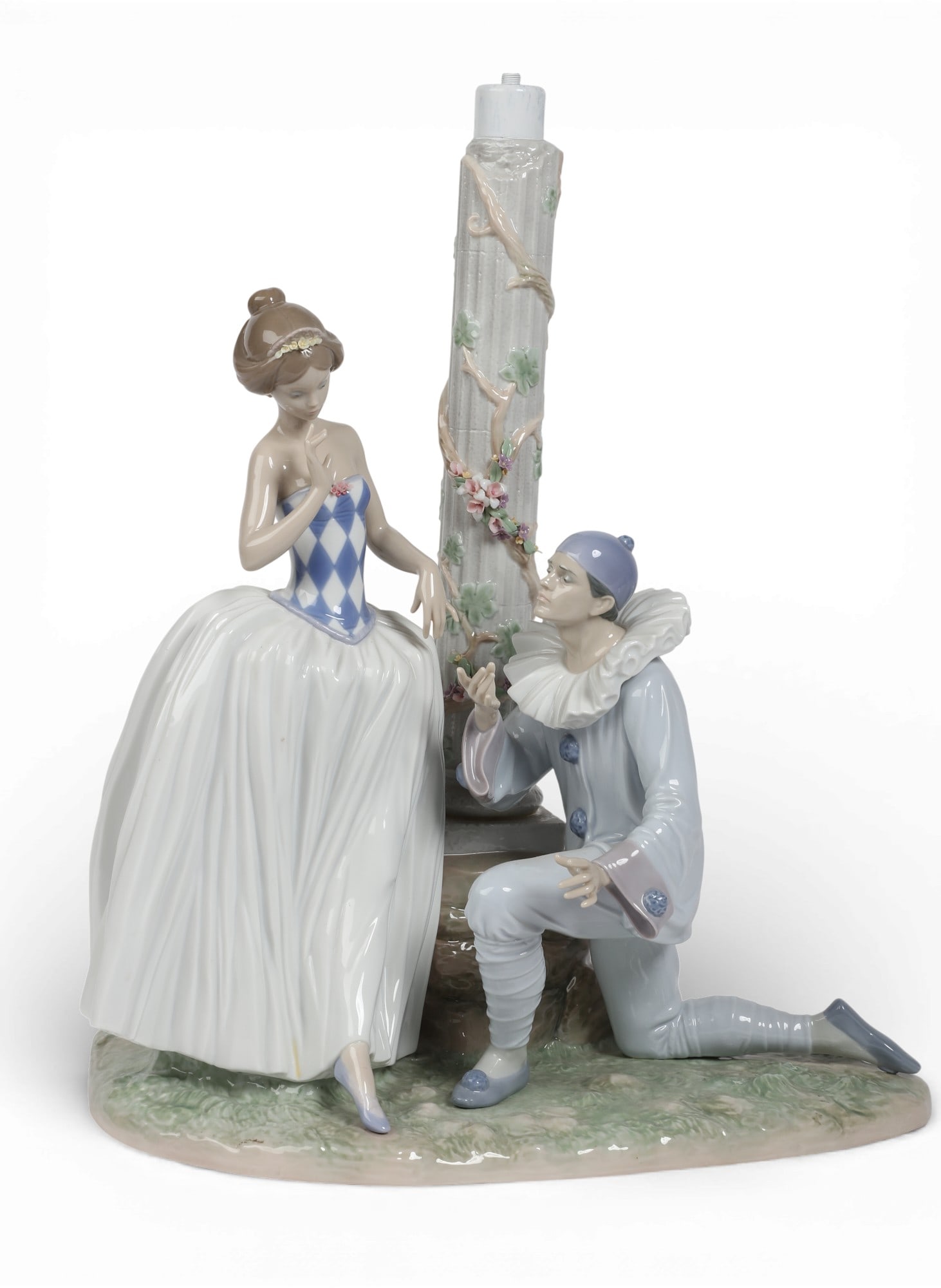 A Lladro figural table lamp: A Lladro figural table lamp height 20in (51cm); width 17in (43cm); depth 12in (30.5cm) Provenance: Property from a Private Collection, Beverly Hills, California.