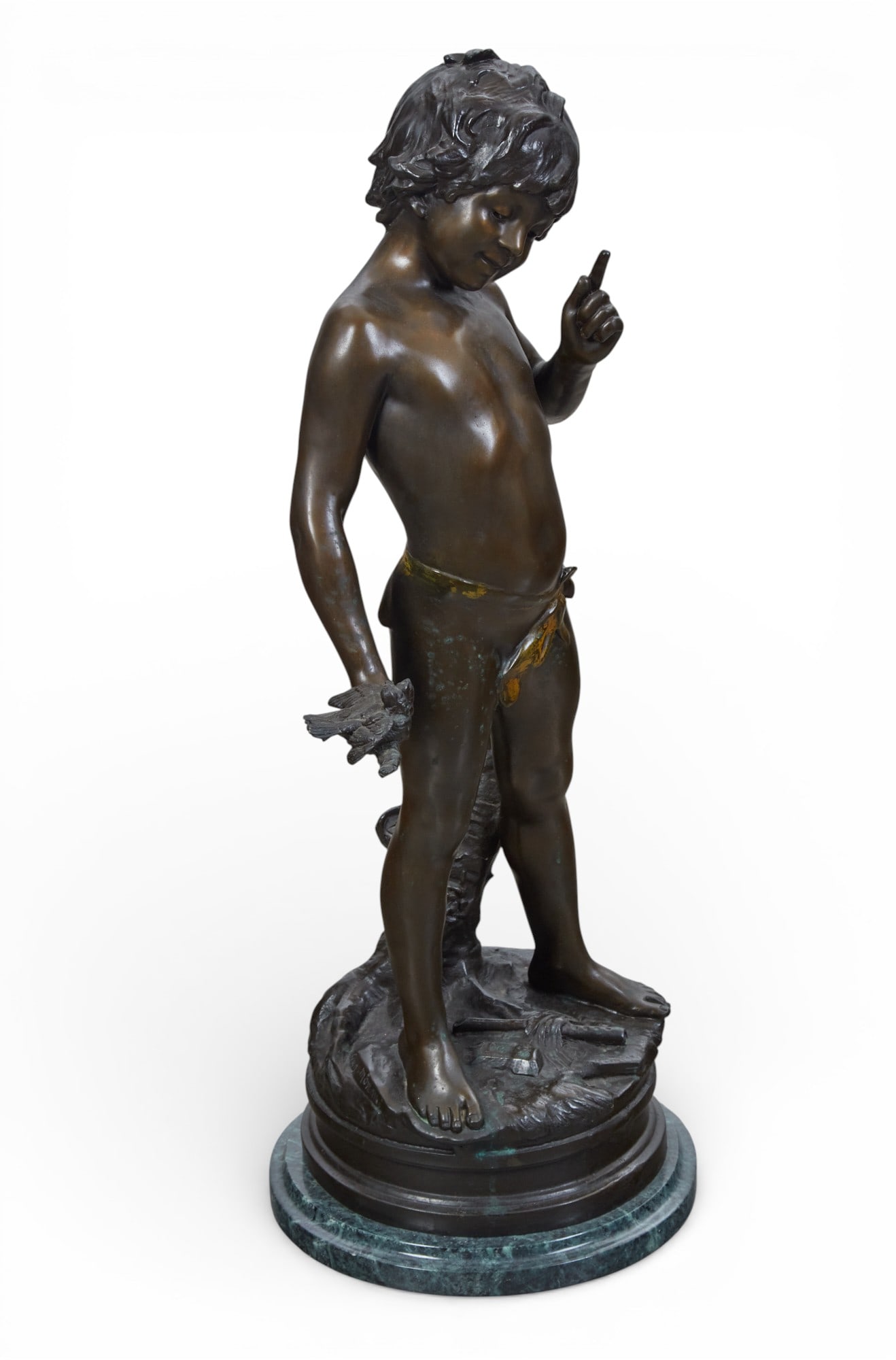 A bronze sculpture of a boy with marble base: A bronze sculpture of a boy with marble base height 30 x width 15 in. (76.2 x 38.1 cm.)