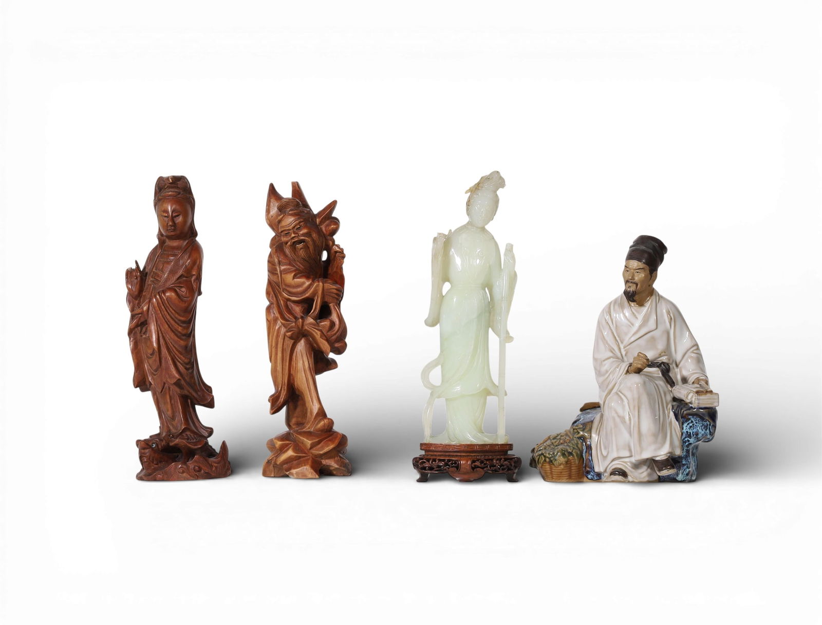 A group of four decorative scholar and figural objects: A group of four decorative scholar and figural objectsLargest: height 11 3/4 x width 4 in. (29.8 x 10.2 cm.)
