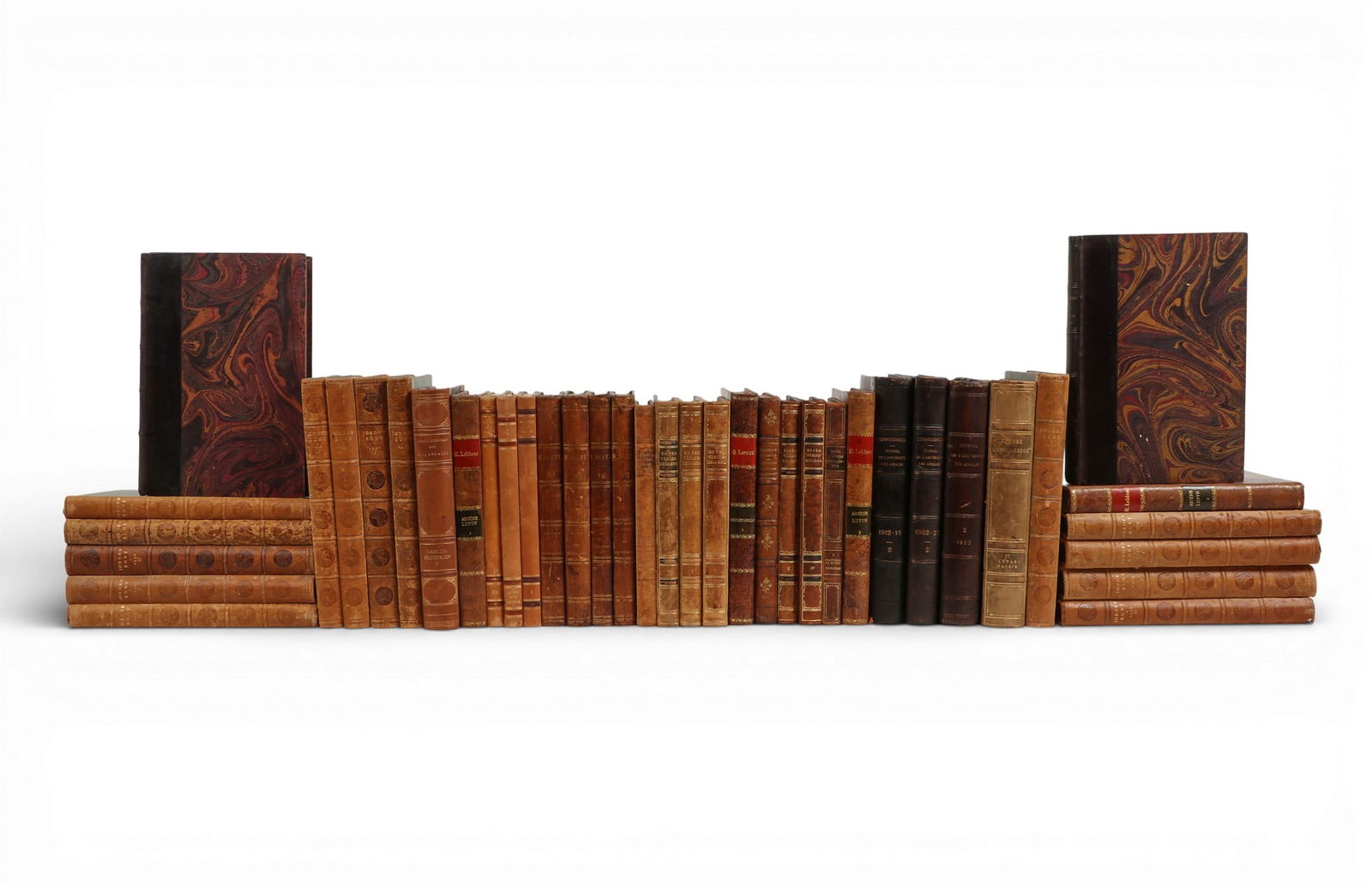 A group of forty mixed leather-bound books as bindings: A group of forty mixed leather-bound books as bindingslot includes 40 leather bound books some with decorative marbled boards, mostly in French.