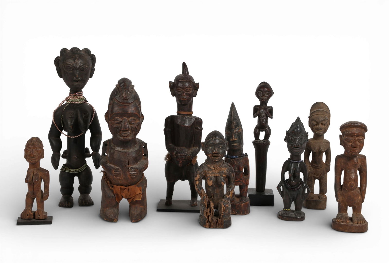 A group of ten carved wood african figures. (1 of 5)