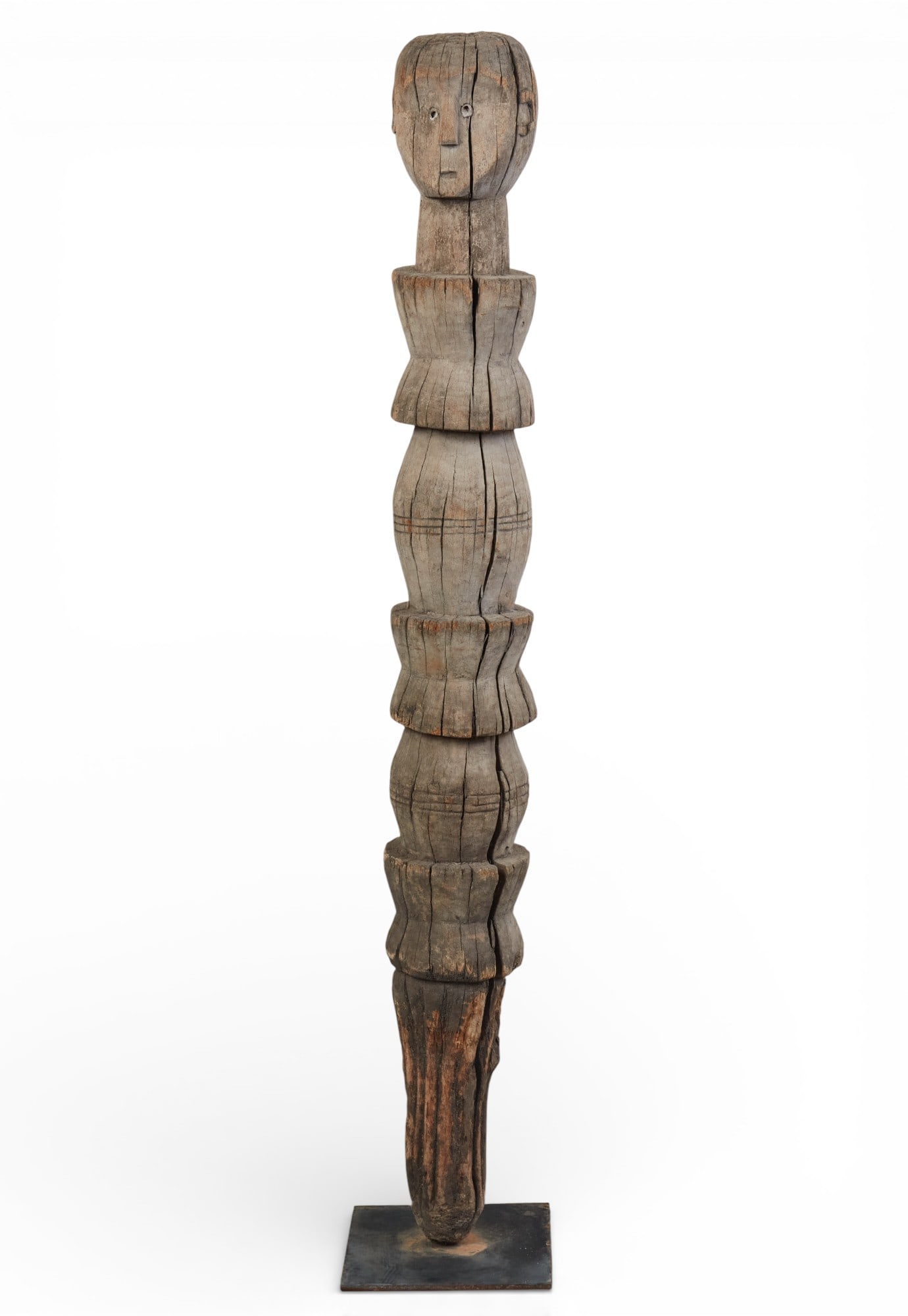 A carved wood African sculpture on metal stand (1 of 5)