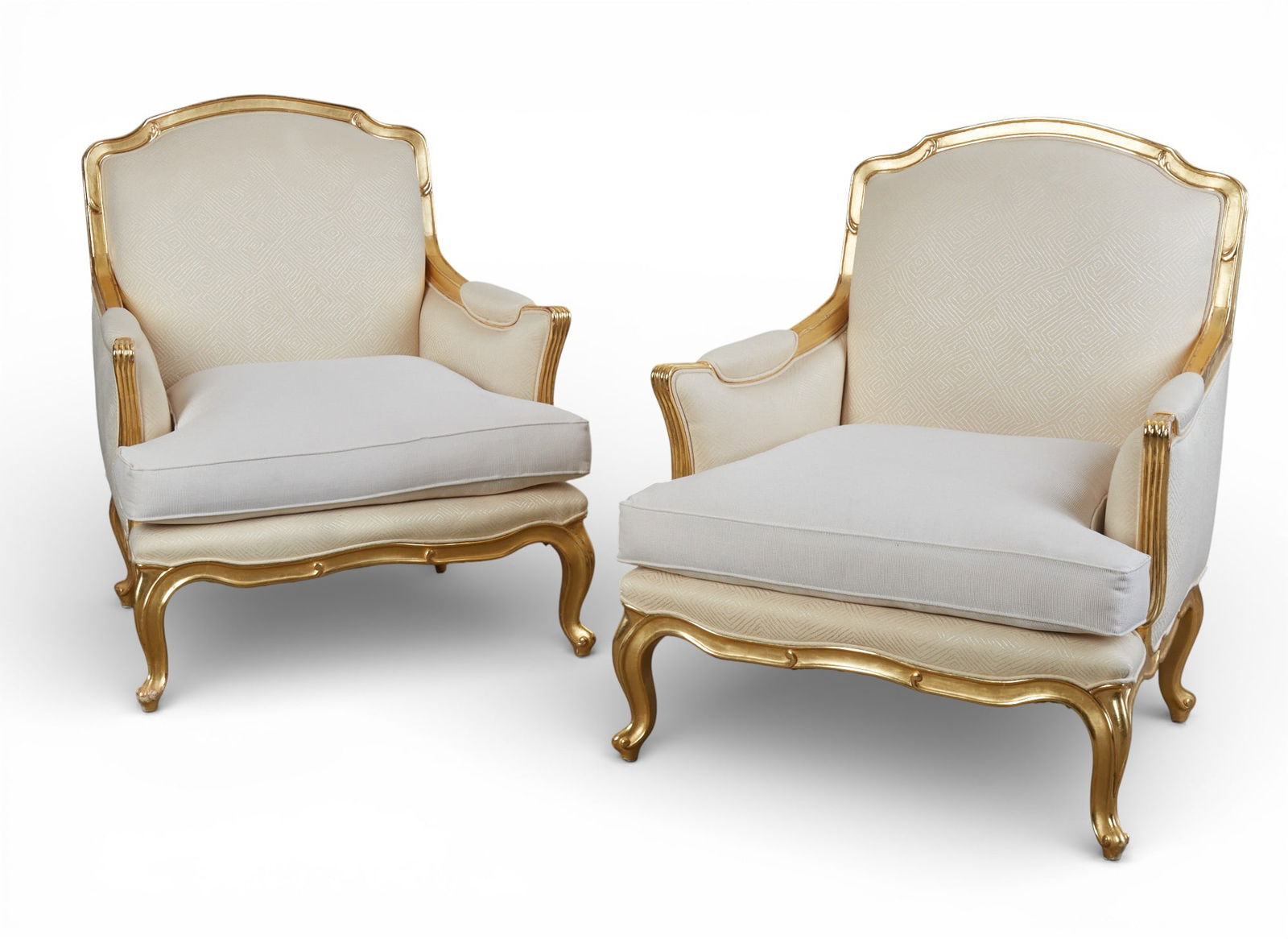 A pair of gilt wood armchairs: A pair of gilt wood armchairs height 42 1/2 x width 34 x depth 34 in. (108 x 86.4 x 86.4 cm.)