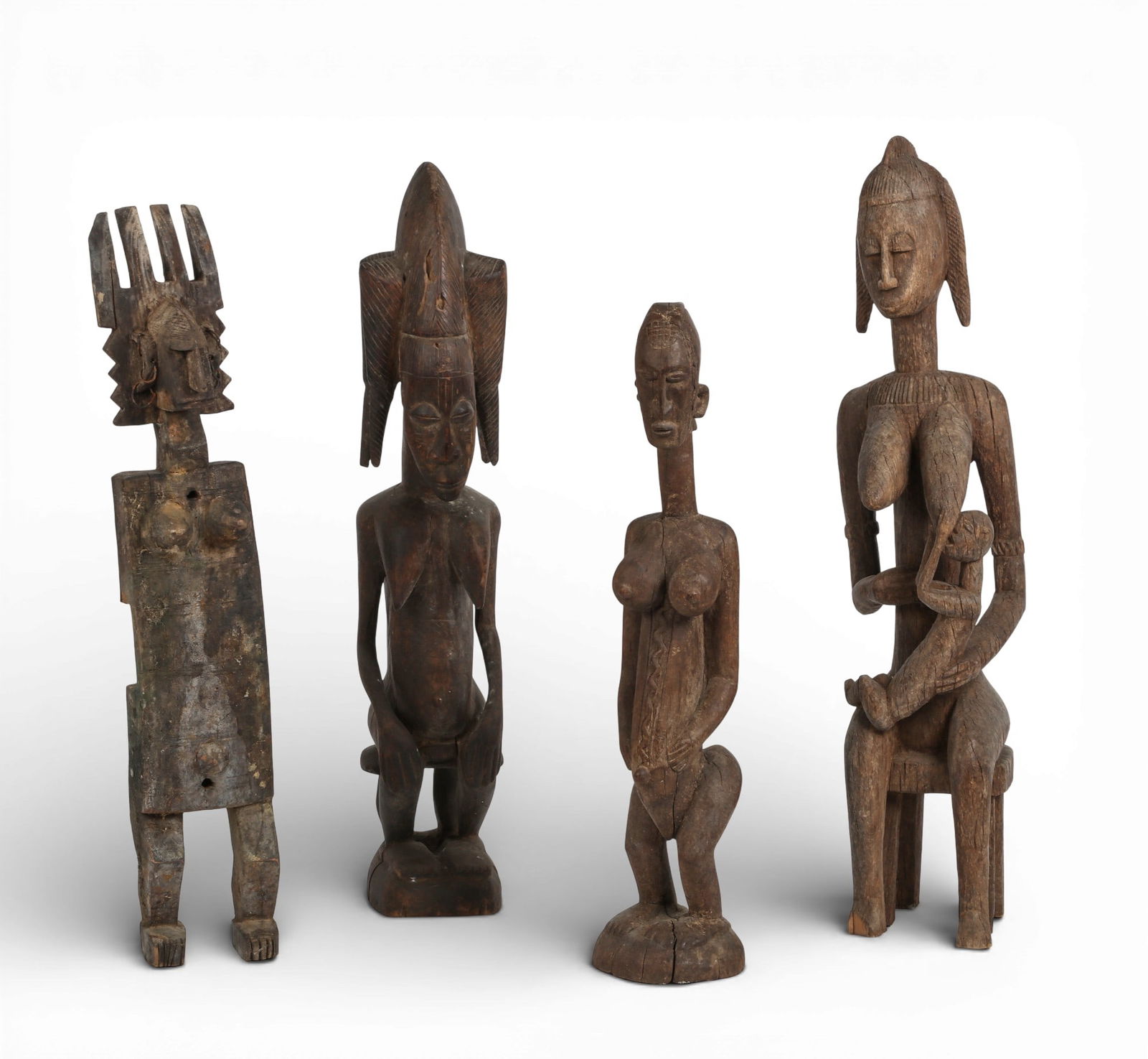 A group of four carved wood african figures. (1 of 6)