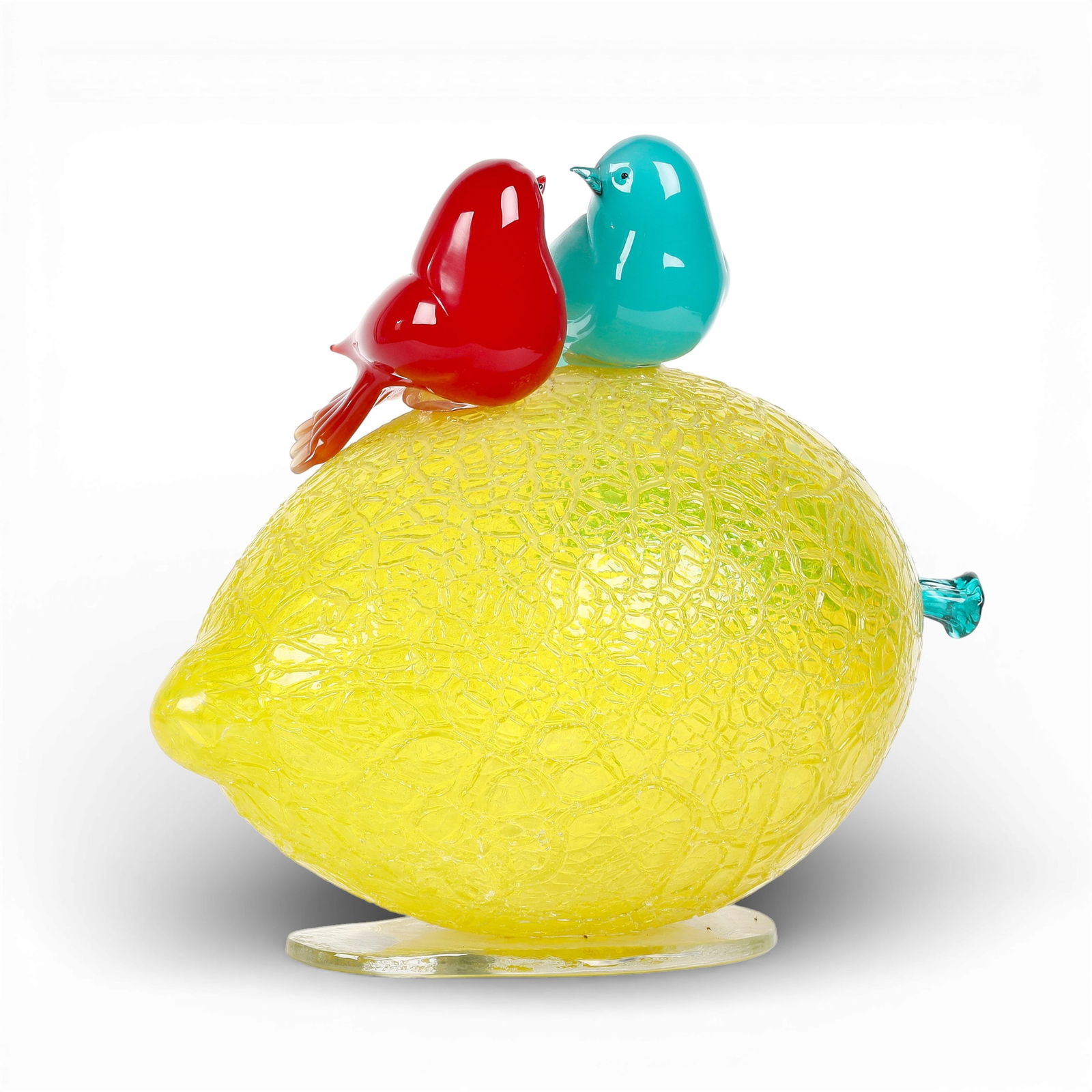 An art glass sculpture featuring two birds on a lemon shape base: An art glass sculpture featuring two birds on a lemon shape base height 12 x width 14 x depth 8 in. (30.5 x 35.6 x 20.3 cm.)