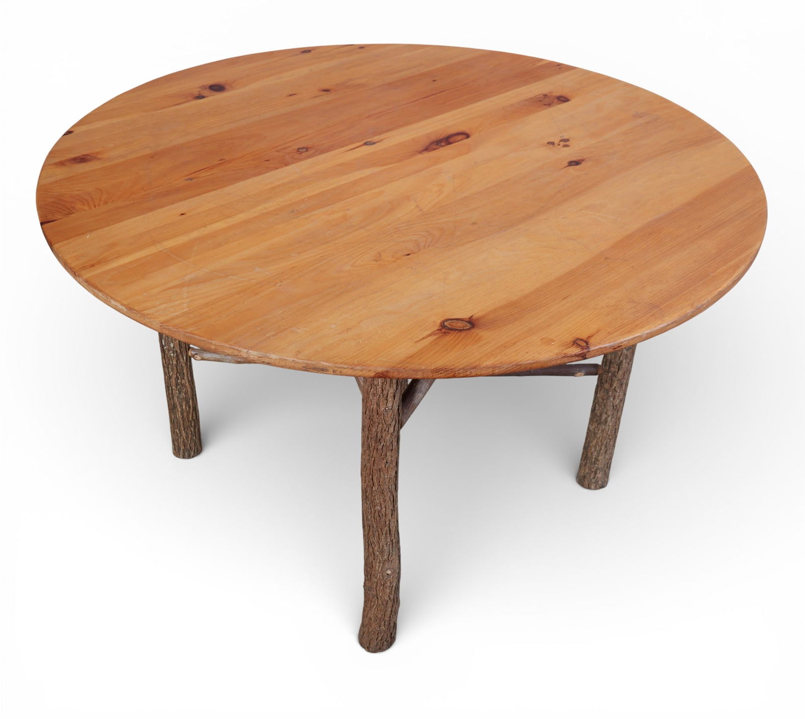 A rustic round table with pine top - 4