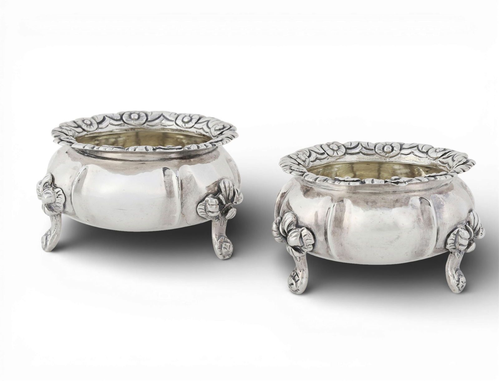 A pair of George IV sterling silver salt cellars, maker's mark IW, London, 1825: A pair of George IV sterling silver salt cellarsmaker's mark IW, London1825height 2in (5cm); diameter 3 1/2in (9cm); total weight approximately 9oz troy Provenance:Property from the Collection