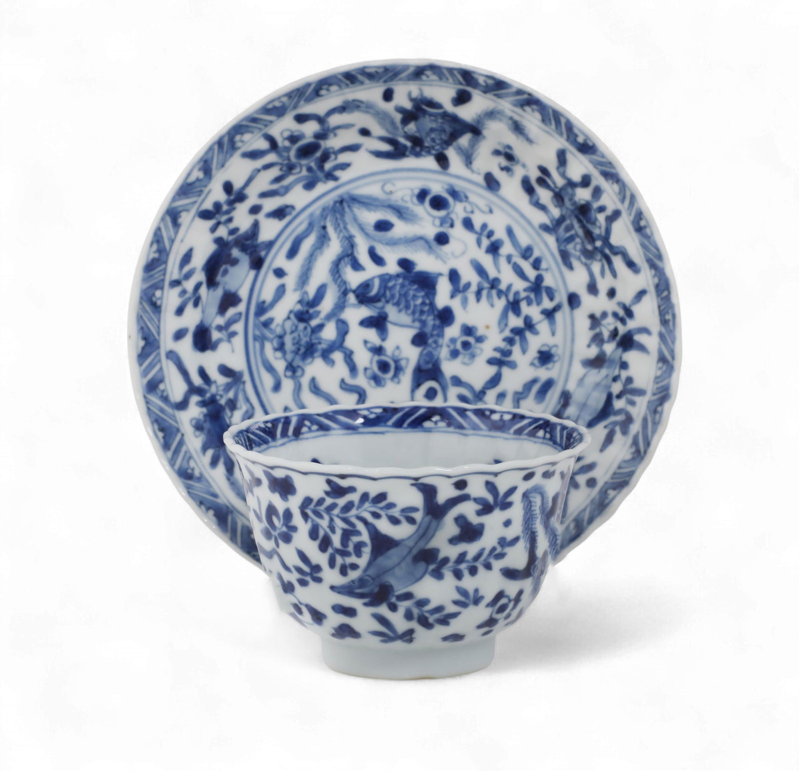 A Chinese blue and white glazed porcelain tea bowl and saucer: A Chinese blue and white glazed porcelain tea bowl and saucerWith underglaze blue character mark to undersides.height overall 2 1/4in (5.5cm); diameter 5in (12.5cm) Provenance:With Robert McPherson A