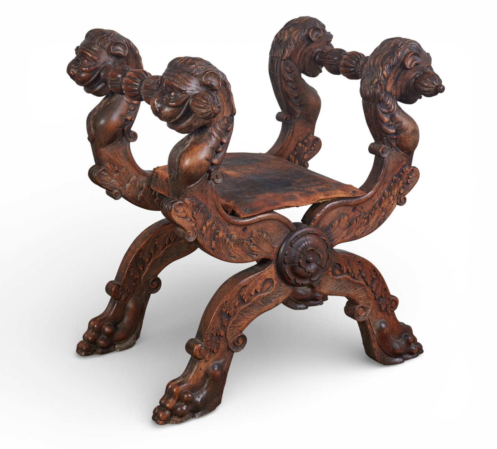 An imposing Continental Baroque style walnut folding stool, composed of antique and later elements (1 of 12)