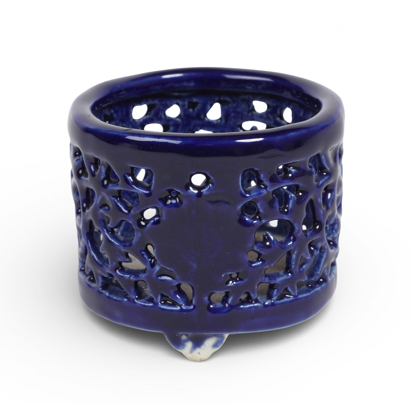 An Asian cobalt glazed reticulated brush pot, possibly Korean: An Asian cobalt glazed reticulated brush potpossibly Koreanheight 2 1/2in (6cm); diameter 3in (7.5cm) Provenance:Property from the Preiser Collection.