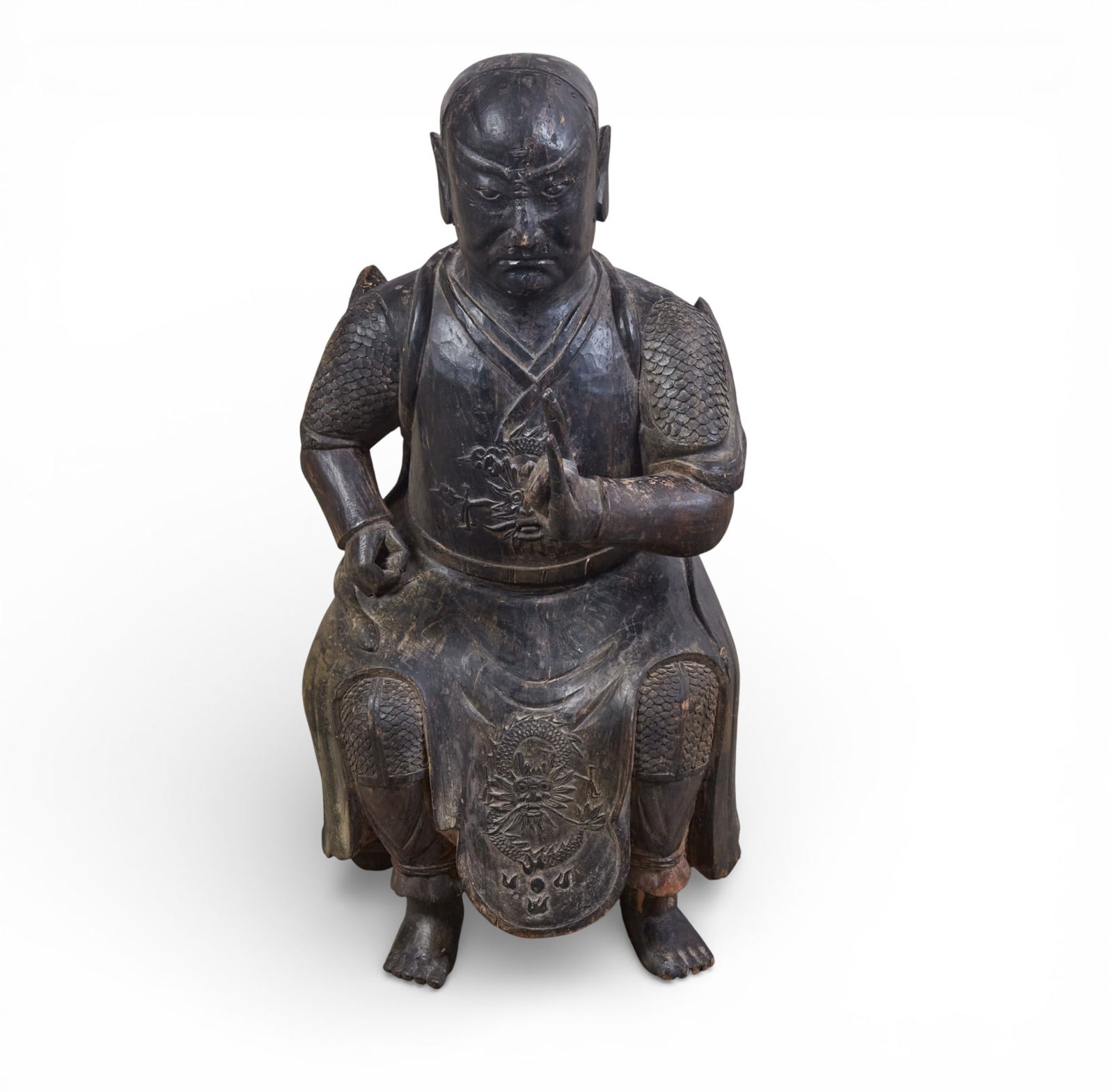 An Asian carved and painted wood model of a seated figure: An Asian carved and painted wood model of a seated figureheight 24 1/4in (62cm); width 12in (30.5cm); depth 9 1/2in (24cm) Provenance:Property from a Private Collection, San Francisco, California.