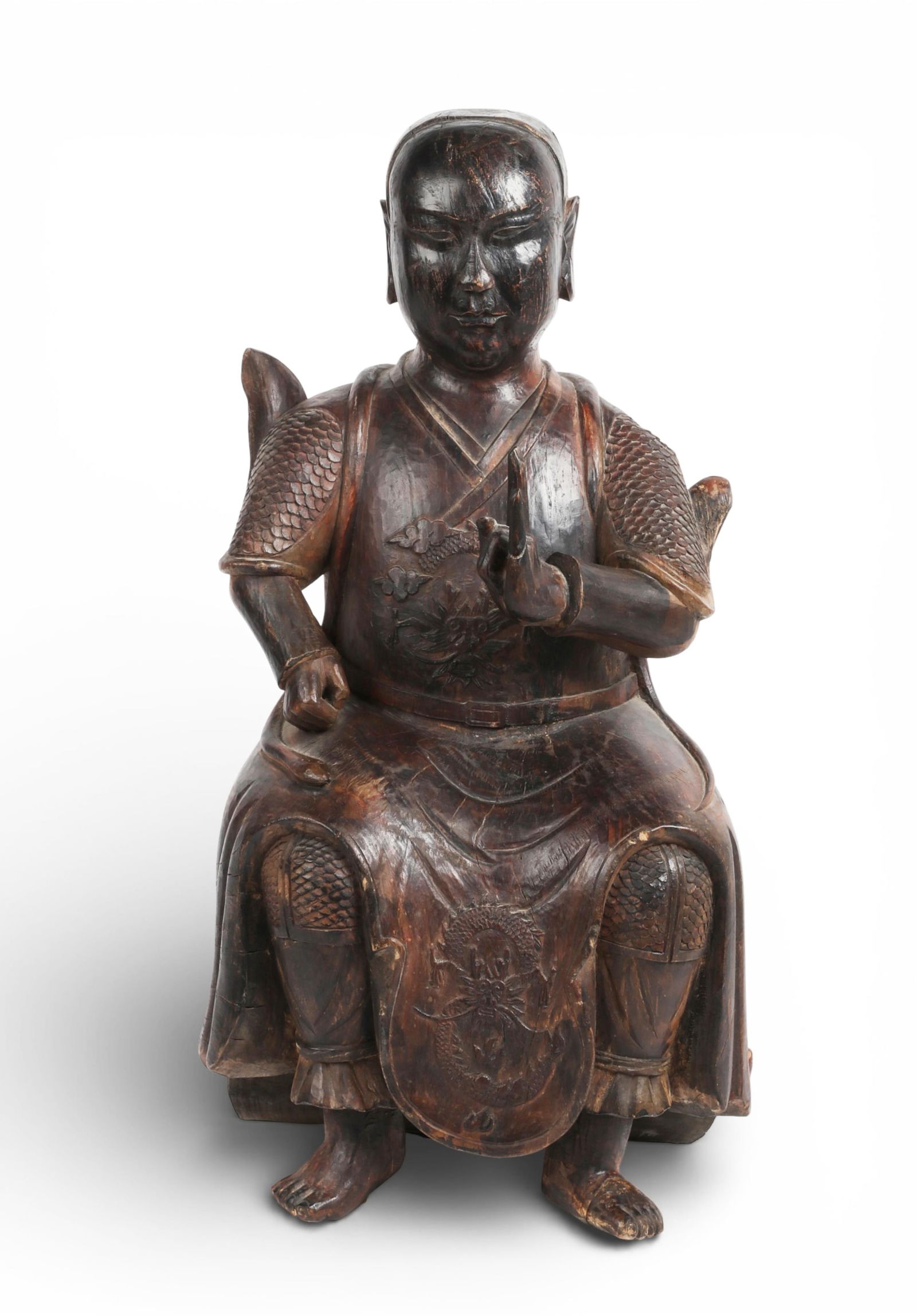 A large Asian carved and painted wood model of a seated figure: A large Asian carved and painted wood model of a seated figureheight 26 1/2in (67cm); width 12 1/2in (32cm); depth 10in (25.5cm) Provenance:Property from a Private Collection, San Francisco, Californi