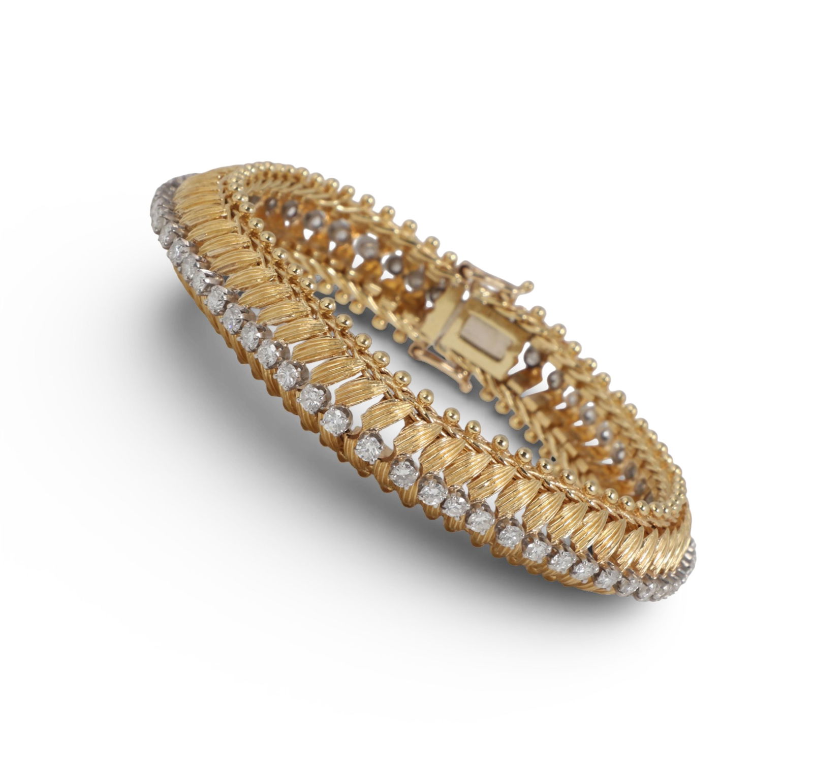 A diamond and 18K yellow gold bracelet,length approximately 7in (17.75cm); width .5in (12.5mm) (1 of 5)