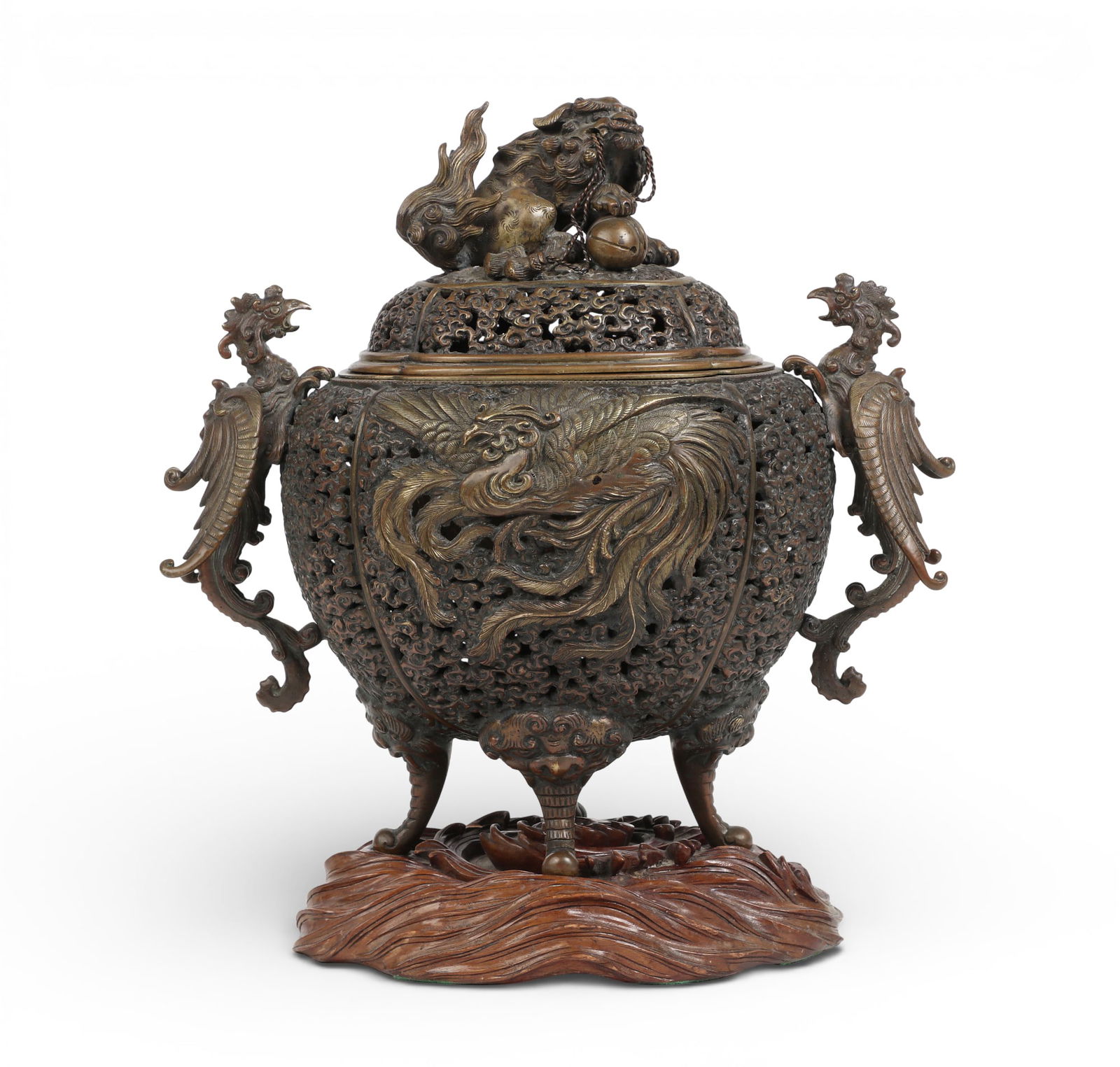 A Japanese patinated bronze koro on hardwood stand: A Japanese patinated bronze koro on hardwood standOval pad seal mark to underside.overall height 13 1/2in (34cm); width 12 1/2in (32cm); depth 8in (20cm) Provenance:Property from a Private Collection