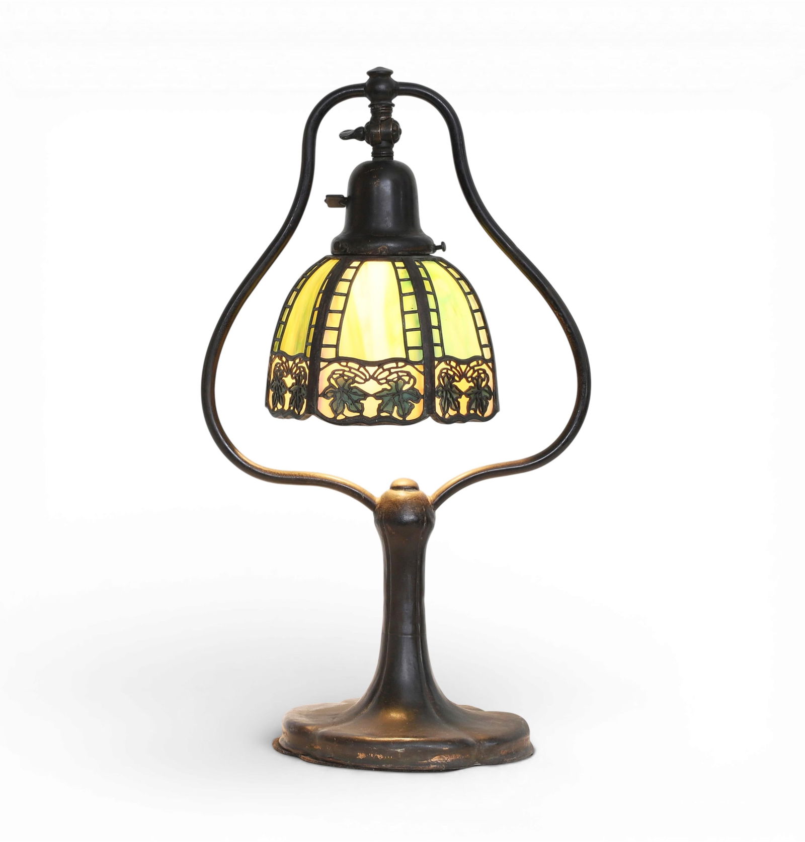 A HandelTeroca' leaded green slag glass and patinated mixed metal maple leaf border desk lamp, early: A HandelTeroca' leaded green slag glass and patinated mixed metal maple leaf border desk lampearly 20th centuryShade and base incised HANDEL.height 17 1/2in (43cm); width 10 1/4in (25.5cm); depth 6 1/