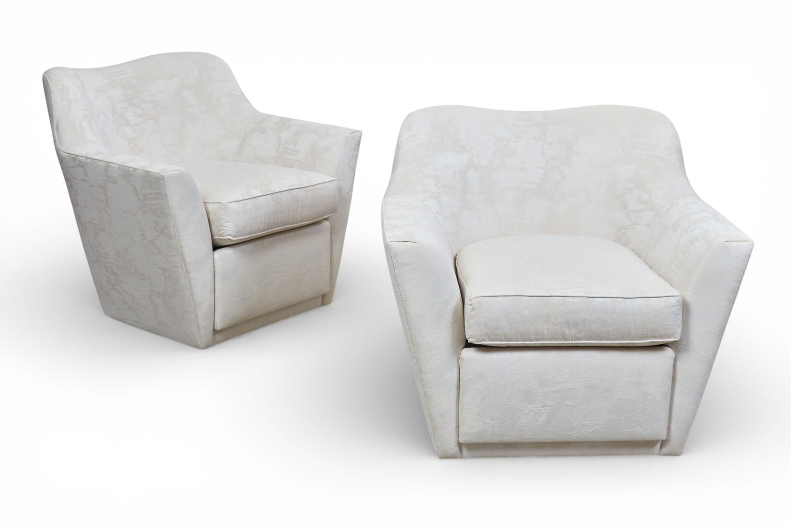 A pair of Studio Van den Akker beige upholstered Nicholas swivel club chairs, modern (1 of 8)