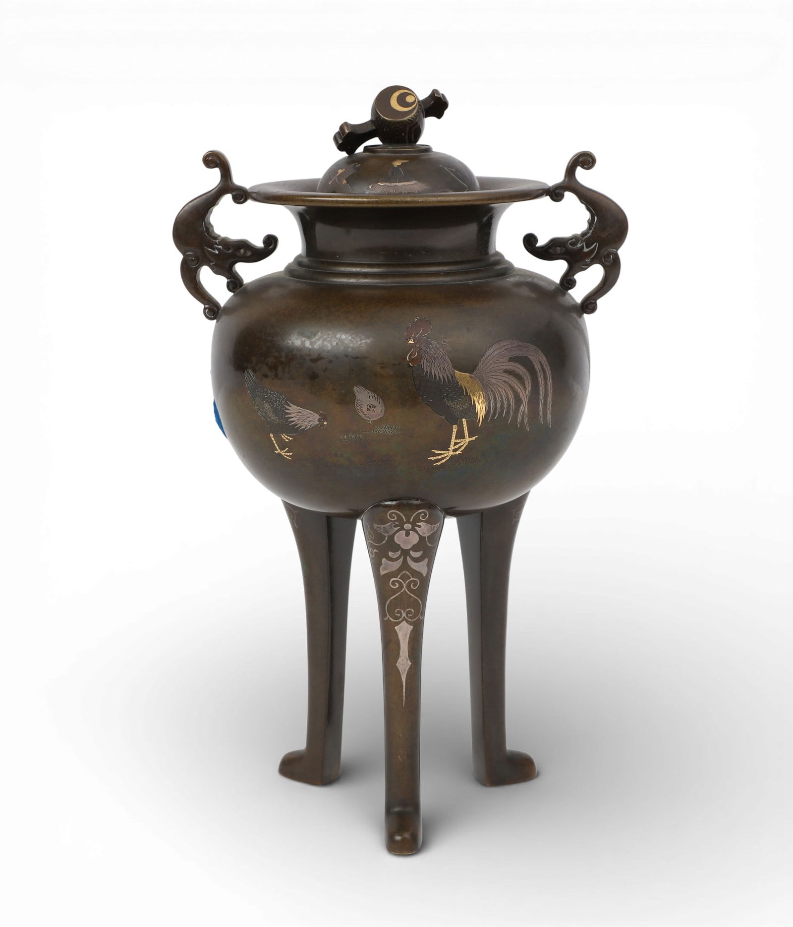 A Japanese metal inlaid patinated bronze covered vessel: A Japanese metal inlaid patinated bronze covered vesselWith three character mark below one handle.height 9 1/4in (23.5cm); width 6in (15cm); depth 5in (13cm) Provenance:Property from a Private Collec