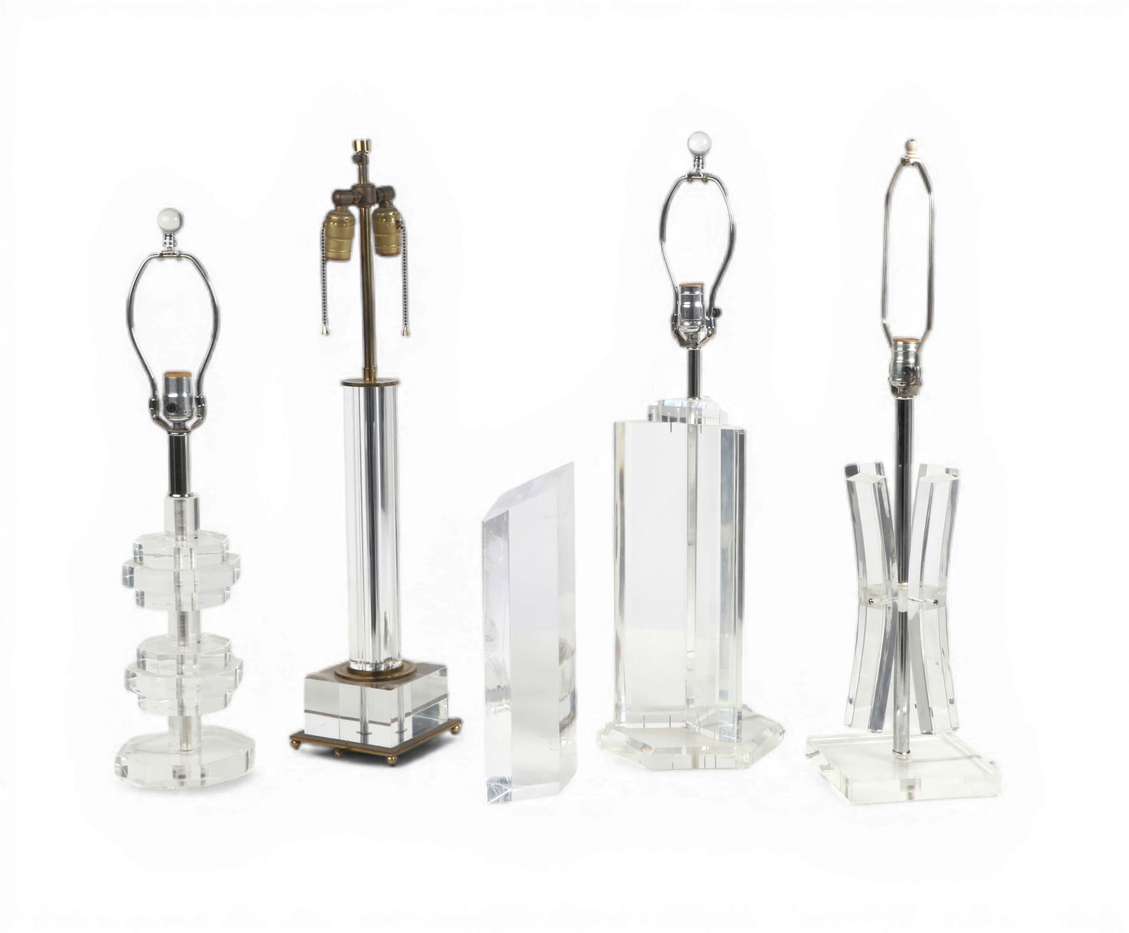 A group of four lucite table lamps together with a lucite sculpture: A group of four lucite table lamps together with a lucite sculpture Tallest: height 30 x diameter 7 in. (76.2 x 17.8 cm.)