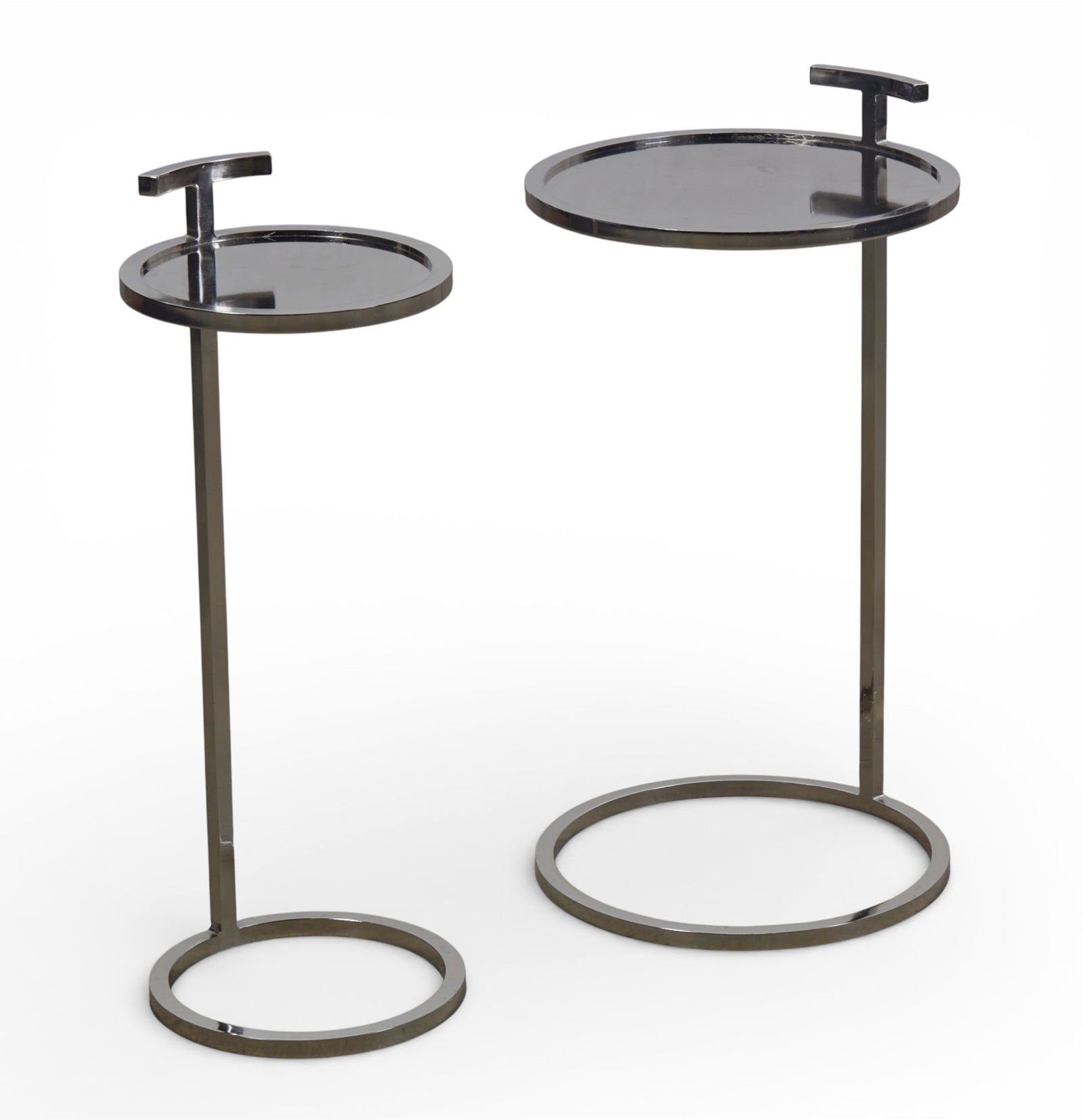 Two silvered metal and mirrored occasional table and a nest of three tables, modern: Two silvered metal and mirrored occasional table and a nest of three tables modern largest height 26 1/2in (67cm); diameter 14in (36cm)