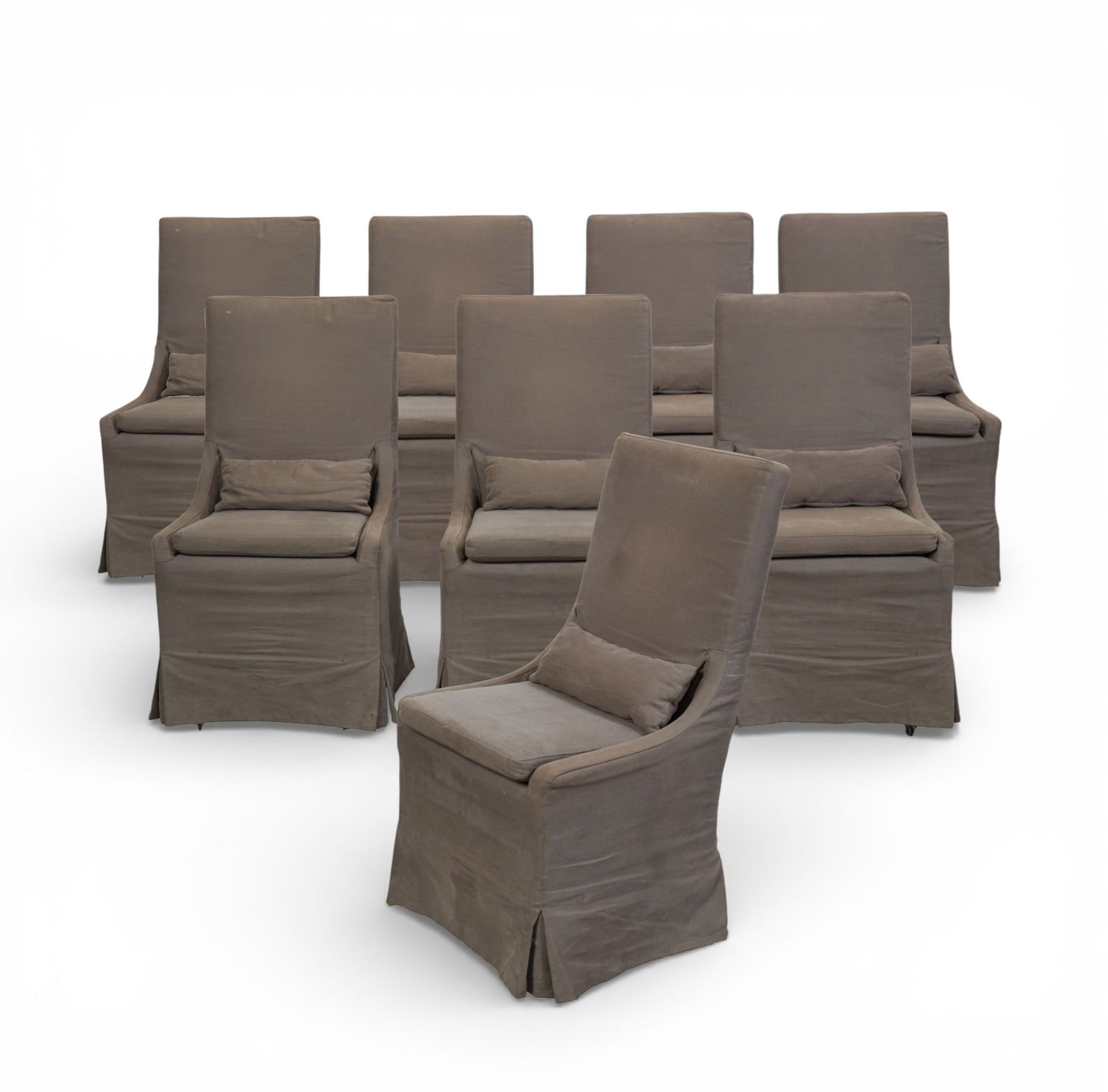 A set of eight Restoration Hardware dining chairs, modern: A set of eight Restoration Hardware dining chairs modern With loose covers and each with small pillow. On castors. RH label to underside. height 41 in (104cm); width 22 v1/2in (57cm); depth of seat