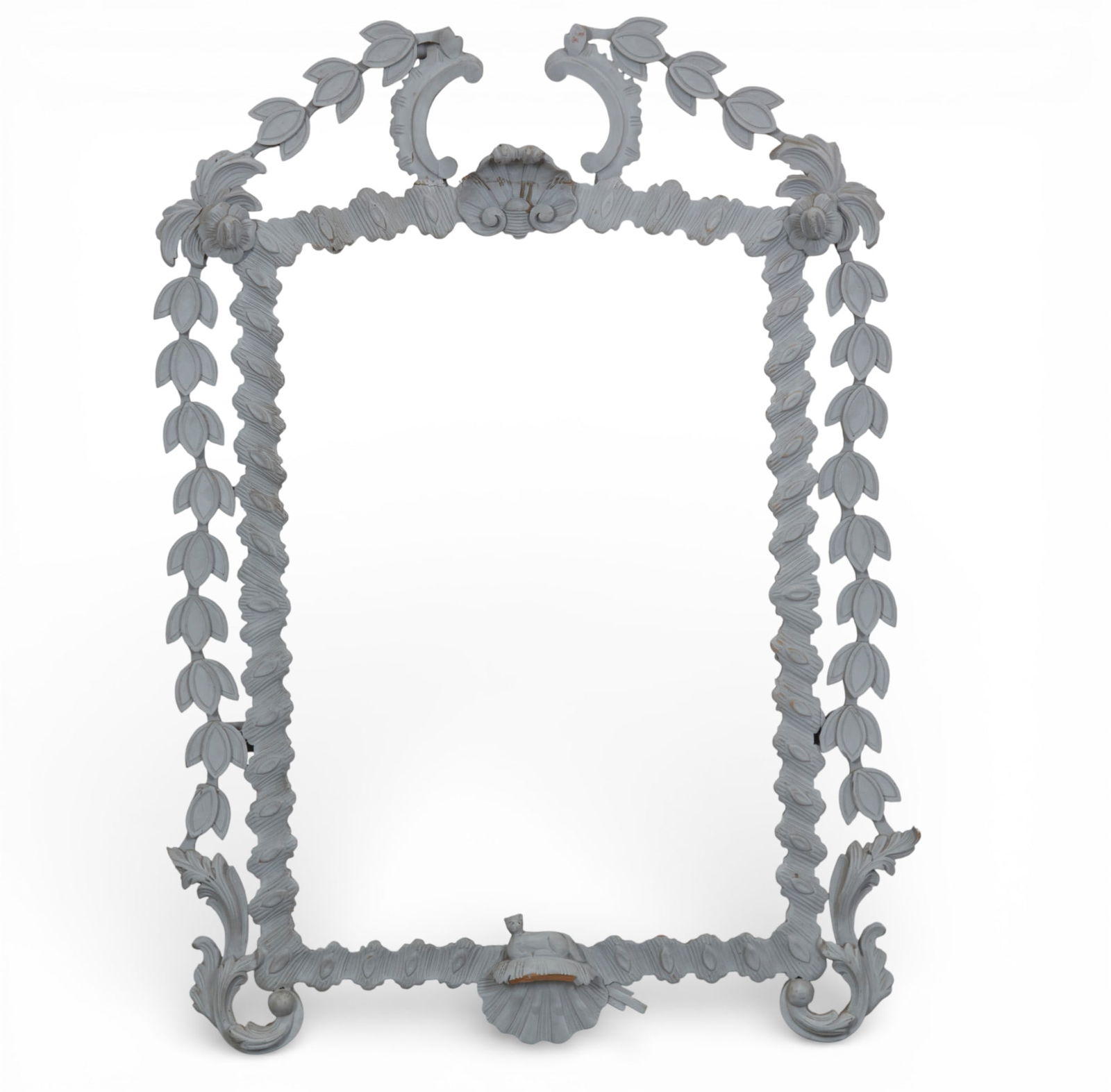 A Baroque style white painted mirror frame, modern: A Baroque style white painted mirror frame modern Lacking mirror plate. height 39 1/2in (100cm); width 28in (71cm)