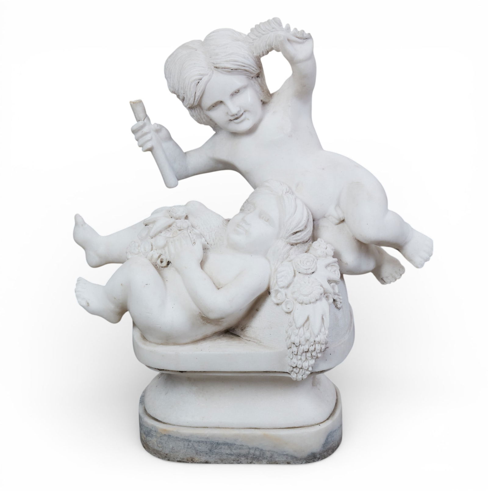 A marble group of two cherubs: A marble group of two cherubs height 31 x width 27 x depth 15 in. (78.7 x 68.6 x 38.1 cm.)