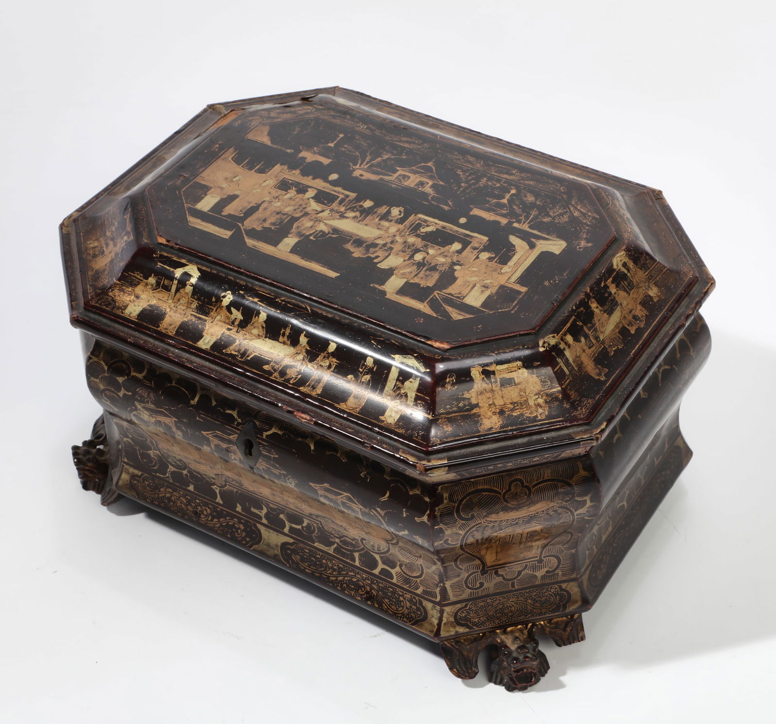 A Chinese Export gilt and black lacquer tea caddy, mid 19th century: A Chinese Export gilt and black lacquer tea caddy mid 19th century With lidded Paktong interior. height 6in (15cm); width 11in (28cm); depth 8 1/2in (22cm)